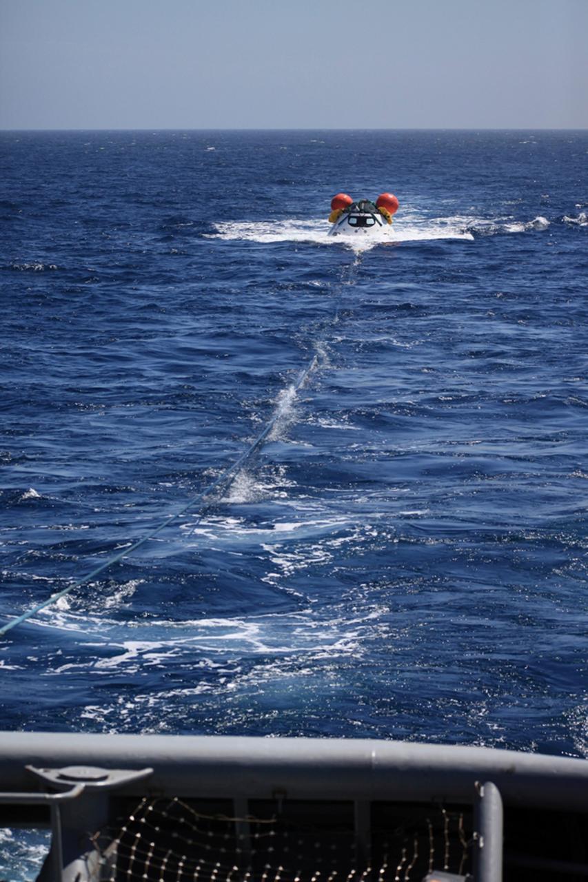 SAN DIEGO, Calif. – On the third day of Underway Recovery Test 4A, the Orion boilerplate test vehicle floats in the Pacific Ocean near the USS Salvor, a safeguard-class rescue and salvage ship. Tether lines from the ship have been attached to Orion for a towing test. NASA, Lockheed Martin and the U.S. Navy are conducting the test to prepare for recovery of the Orion crew module on its return from a deep space mission. The underway recovery test allows the teams to demonstrate and evaluate the recovery processes, procedures, new hardware and personnel in open waters. The Ground Systems Development and Operations Program is conducting the underway recovery test. Orion is the exploration spacecraft designed to carry astronauts to destinations not yet explored by humans, including an asteroid and Mars. It will have emergency abort capability, sustain the crew during space travel and provide safe re-entry from deep space return velocities. The first unpiloted test flight of the Orion is scheduled to launch in December 2014 atop a United Launch Alliance Delta IV Heavy rocket and in 2018 on NASA’s Space Launch System rocket. For more information, visit http://www.nasa.gov/orion. Photo credit: NASA/Kim Shiflett