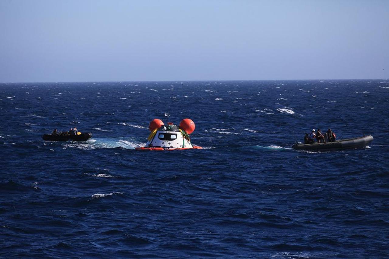 SAN DIEGO, Calif. – On the third day of Underway Recovery Test 4A, the Orion boilerplate test vehicle floats in the Pacific Ocean near the USS Salvor, a safeguard-class rescue and salvage ship. Orion was lowered into the water with a stationary crane from the ship. Tether lines from the ship have been attached to Orion for a towing test. Nearby, Navy divers in Zodiac boats monitor Orion and practice recovery procedures. NASA, Lockheed Martin and the U.S. Navy are conducting the test to prepare for recovery of the Orion crew module on its return from a deep space mission. The underway recovery test allows the teams to demonstrate and evaluate the recovery processes, procedures, new hardware and personnel in open waters. The Ground Systems Development and Operations Program is conducting the underway recovery test. Orion is the exploration spacecraft designed to carry astronauts to destinations not yet explored by humans, including an asteroid and Mars. It will have emergency abort capability, sustain the crew during space travel and provide safe re-entry from deep space return velocities. The first unpiloted test flight of the Orion is scheduled to launch in December 2014 atop a United Launch Alliance Delta IV Heavy rocket and in 2018 on NASA’s Space Launch System rocket. For more information, visit http://www.nasa.gov/orion. Photo credit: NASA/Kim Shiflett