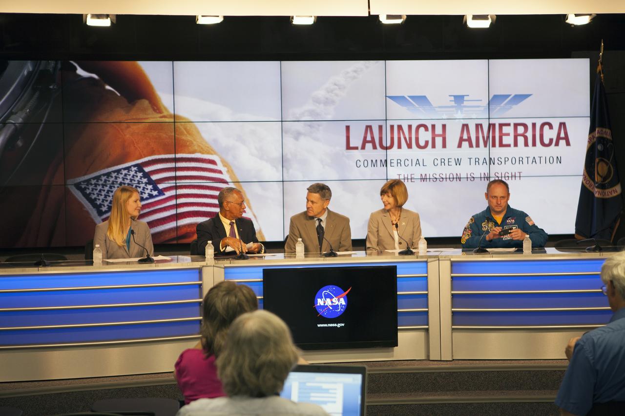 CAPE CANAVERAL, Fla. – NASA spokeswoman Stephanie Schierholz, from left, listens as Charles Bolden, NASA administrator, speaks with former astronaut Bob Cabana, director of NASA's Kennedy Space Center in Florida and Kathy Lueders, manager of the agency's Commercial Crew Program, before the announcement of the Commercial Crew Transportation Capability CCtCap contract awards designed to complete the NASA certification for human space transportation systems capable of carrying people into orbit. Astronaut and former International Space Station Commander Mike Fincke also took part in the announcement. Once certification is complete, NASA plans to use these systems to ferry astronauts to the International Space Station and return them safely to Earth.  Speaking from Kennedy Space Center’s Press Site, Bolden detailed the importance of the effort by the agency's Commercial Crew Program for United States space exploration ambitions and the economic potential of creating new markets in space transportation for people. Boeing and SpaceX were awarded contracts to complete the design of the CST-100 and Crew Dragon spacecraft, respectively, and begin manufacturing for flight tests with a goal of achieving certification to take astronauts to the International Space Station by 2017. CCtCap also covers the beginning of operational missions for these new spacecraft and their systems. Photo credit: NASA/Jim Grossmann