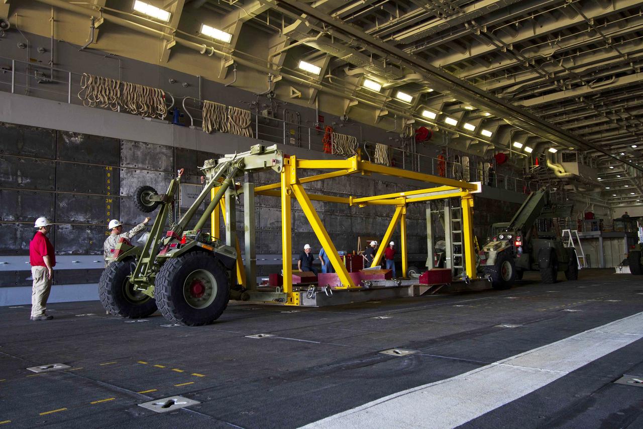 SAN DIEGO, Calif. – The USS Anchorage is docked at Naval Base San Diego during loading operations in its well deck for Orion Underway Recovery Test 3. The ship will head out to sea, off the coast of San Diego, in search of conditions to support test needs for a full dress rehearsal of recovery operations. NASA, Lockheed Martin and U.S. Navy personnel will conduct tests in the Pacific Ocean to prepare for recovery of the Orion crew module on its return from a deep space mission. The test will allow the teams to demonstrate and evaluate the recovery processes, procedures, new hardware and personnel in open waters.    The Ground Systems Development and Operations Program is conducting the underway recovery tests. Orion is the exploration spacecraft designed to carry astronauts to destinations not yet explored by humans, including an asteroid and Mars. It will have emergency abort capability, sustain the crew during space travel and provide safe re-entry from deep space return velocities. The first unpiloted test flight of Orion is scheduled to launch in 2014 atop a United Launch Alliance Delta IV Heavy rocket and in 2018 on NASA’s Space Launch System rocket. For more information, visit http://www.nasa.gov/orion. Photo credit: NASA/Cory Huston
