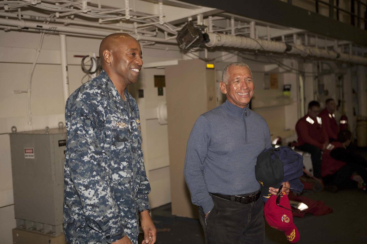 SAN DIEGO, Calif. – NASA Administrator Charlie Bolden, at right, talks to a member of the U.S. Navy on the USS Anchorage. The ship will head out to sea, off the coast of San Diego, in search of conditions to support test needs for the first day of Orion Underway Recovery Test 3. NASA, Lockheed Martin and U.S. Navy personnel will conduct tests in the Pacific Ocean to prepare for recovery of the Orion crew module on its return from a deep space mission. The test will allow the teams to demonstrate and evaluate the recovery processes, procedures, hardware and personnel in open waters.    The Ground Systems Development and Operations Program is conducting the underway recovery tests. Orion is the exploration spacecraft designed to carry astronauts to destinations not yet explored by humans, including an asteroid and Mars. It will have emergency abort capability, sustain the crew during space travel and provide safe re-entry from deep space return velocities. The first unpiloted test flight of Orion is scheduled to launch in 2014 atop a United Launch Alliance Delta IV Heavy rocket and in 2018 on NASA’s Space Launch System rocket. For more information, visit http://www.nasa.gov/orion. Photo credit: NASA/Cory Huston