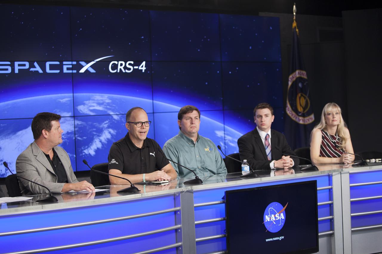 CAPE CANAVERAL, Fla. – Members of an ISS Research and Technology Panel brief media representatives in Kennedy Space Center’s Press Site auditorium in preparation for the launch of the SpaceX CRS-4 mission to resupply the International Space Station. From left are Duane Ratliff, chief operating officer, CASIS, Mike Yagley, COBRA PUMA Golf, director of Research and Testing, Dr. Eugene Boland, Techshot chief scientist, Jason Gilbert, scientific associate, Novartis Institutes for BioMedical Research, and Niki Werkheiser, 3D Printing in Zero-G project manager.      The mission is the fourth of 12 SpaceX flights NASA contracted with the company to resupply the space station. It will be the fifth trip by a Dragon spacecraft to the orbiting laboratory. The spacecraft’s 2.5 tons of supplies, science experiments, and technology demonstrations include critical materials to support 255 science and research investigations that will occur during the station's Expeditions 41 and 42. Liftoff is targeted for an instantaneous window at 2:14 a.m. EDT. To learn more about the mission, visit http://www.nasa.gov/mission_pages/station/structure/launch/index.html. Photo credit: NASA/Jim Grossmann