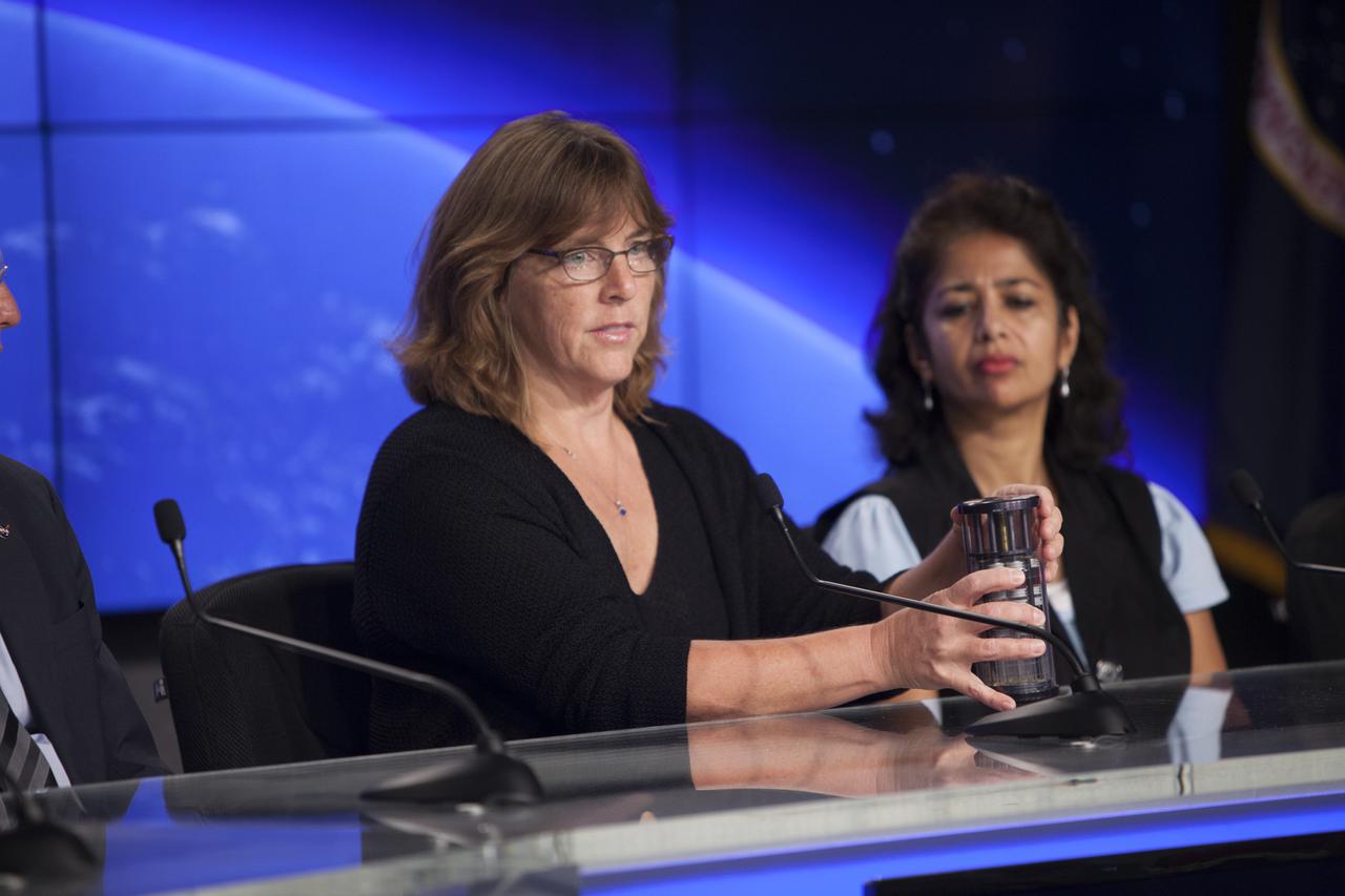 CAPE CANAVERAL, Fla. – Shiela Neilsen, principal investigator, Micro-8, University of Montana, briefs media representatives in Kennedy Space Center’s Press Site auditorium in preparation for the launch of the SpaceX CRS-4 mission to resupply the International Space Station. Neilsen is a member of the ISS Science Panel on Model Organisms.    The mission is the fourth of 12 SpaceX flights NASA contracted with the company to resupply the space station. It will be the fifth trip by a Dragon spacecraft to the orbiting laboratory. The spacecraft’s 2.5 tons of supplies, science experiments, and technology demonstrations include critical materials to support 255 science and research investigations that will occur during the station's Expeditions 41 and 42. Liftoff is targeted for an instantaneous window at 2:14 a.m. EDT. To learn more about the mission, visit http://www.nasa.gov/mission_pages/station/structure/launch/index.html. Photo credit: NASA/Jim Grossmann
