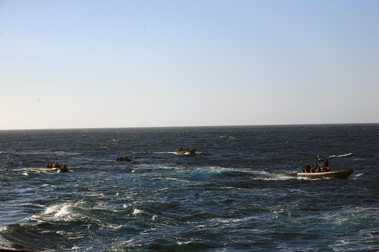 SAN DIEGO, Calif. – During the third day of Orion Underway Recovery Test 3 on the USS Anchorage in the Pacific Ocean, two Zodiac boats with U.S. Navy divers aboard, at left, and two rigid hull inflatable boats with Navy and other team personnel aboard, prepare for recovery of the Orion boilerplate test vehicle. NASA, Lockheed Martin and U.S. Navy personnel are conducting recovery tests using the Orion boilerplate test vehicle to prepare for recovery of the Orion crew module on its return from a deep space mission. The test allows the teams to demonstrate and evaluate the recovery processes, procedures, hardware and personnel in open waters. The Ground Systems Development and Operations Program is conducting the underway recovery tests. Orion is the exploration spacecraft designed to carry astronauts to destinations not yet explored by humans, including an asteroid and Mars. It will have emergency abort capability, sustain the crew during space travel and provide safe re-entry from deep space return velocities. The first unpiloted test flight of Orion is scheduled to launch in 2014 atop a United Launch Alliance Delta IV Heavy rocket and in 2018 on NASA’s Space Launch System rocket. For more information, visit http://www.nasa.gov/orion. Photo credit: NASA/Kim Shiflett