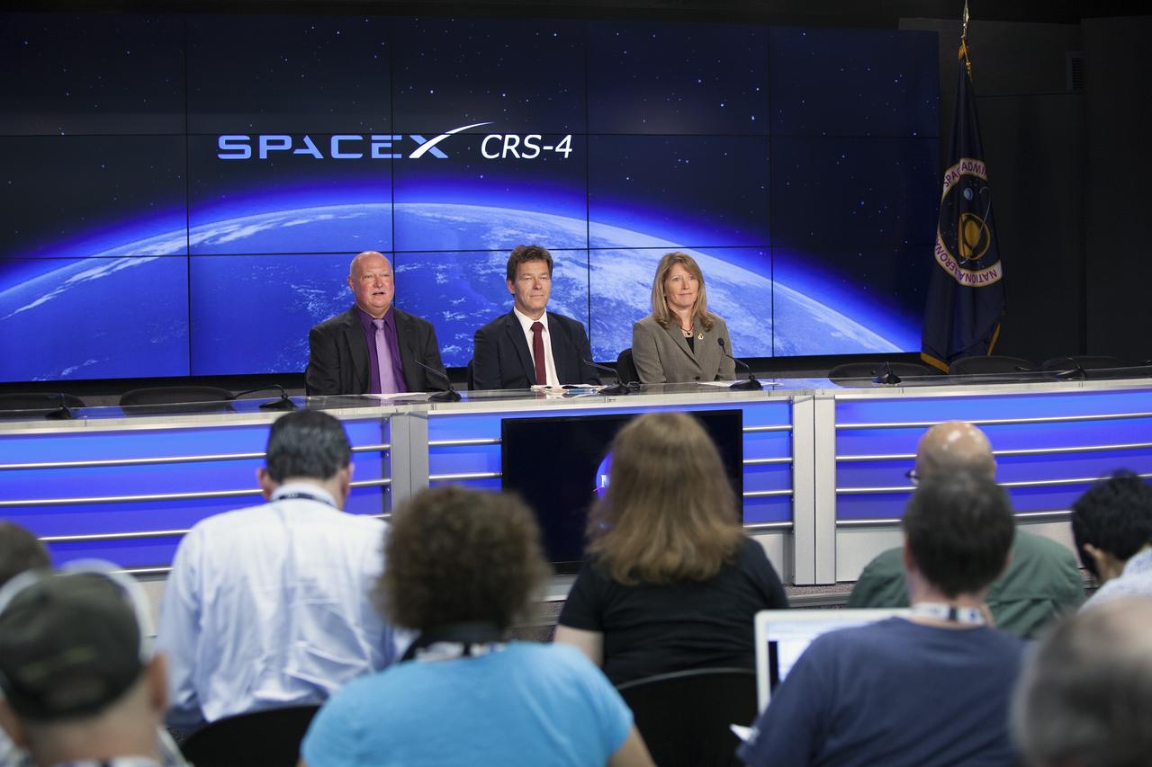 CAPE CANAVERAL, Fla. – In the Kennedy Space Center’s Press Site auditorium, members of news media are briefed on preparations for the launch of the SpaceX CRS-4 mission to resupply the International Space Station. From left are Mike Curie of NASA Public Affairs,   Hans Koenigsmann, vice president of Mission Assurance with SpaceX, and Kathy Winters, launch weather officer for the 45th Weather Squadron. Dan Hartman, deputy program manager of the International Space Station Program, participated by telephone.    The mission is the fourth of 12 SpaceX flights NASA contracted with the company to resupply the space station. It will be the fifth trip by a Dragon spacecraft to the orbiting laboratory. The spacecraft’s 2.5 tons of supplies, science experiments, and technology demonstrations include critical materials to support 255 science and research investigations that will occur during the station's Expeditions 41 and 42. Liftoff is targeted for an instantaneous window at 2:14 a.m. EDT. To learn more about the mission, visit http://www.nasa.gov/mission_pages/station/structure/launch/index.html Photo credit: NASA/Jim Grossmann