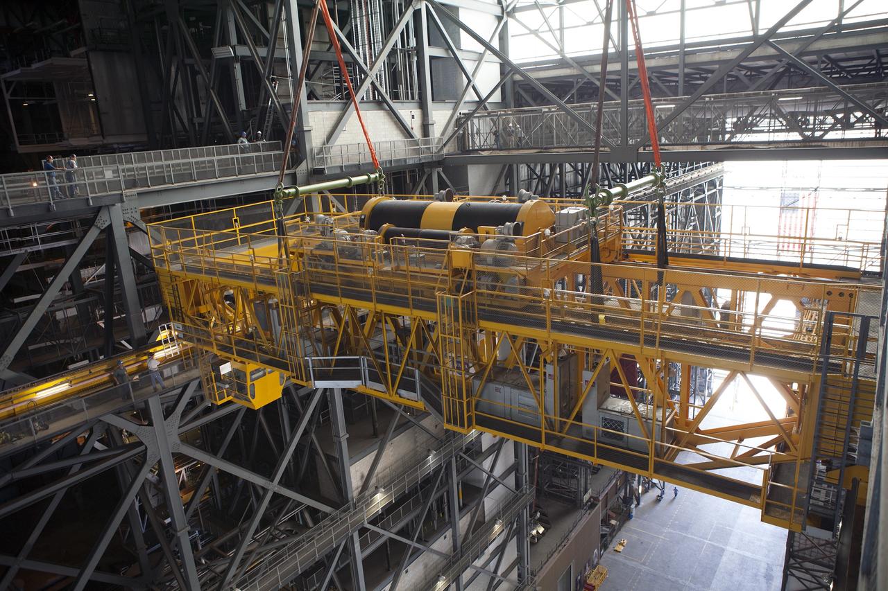 CAPE CANAVERAL, Fla. – Inside the Vehicle Assembly Building, or VAB, at NASA's Kennedy Space Center in Florida, the 175-ton crane is being lowered from Level 16 down to the transfer aisle floor. Upgrades to the crane's 45-year-old controls will be performed in order to improve reliability, precision and safety. The Ground Systems Development and Operations Program is overseeing upgrades and modifications to the VAB. The crane will be upgraded so that it can support lifting needs for NASA and other exploration vehicles, including the agency's Space Launch System and Orion spacecraft. Photo credit: NASA/Daniel Casper