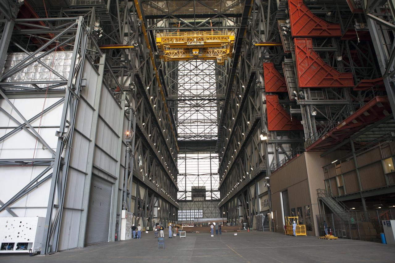 CAPE CANAVERAL, Fla. – Inside the Vehicle Assembly Building, or VAB, at NASA's Kennedy Space Center in Florida, a crane is being used to lower the 175-ton crane from Level 16 down to the transfer aisle floor. Upgrades to the crane's 45-year-old controls will be performed in order to improve reliability, precision and safety. The Ground Systems Development and Operations Program is overseeing upgrades and modifications to the VAB. The crane will be upgraded so that it can support lifting needs for NASA and other exploration vehicles, including the agency's Space Launch System and Orion spacecraft. Photo credit: NASA/Daniel Casper