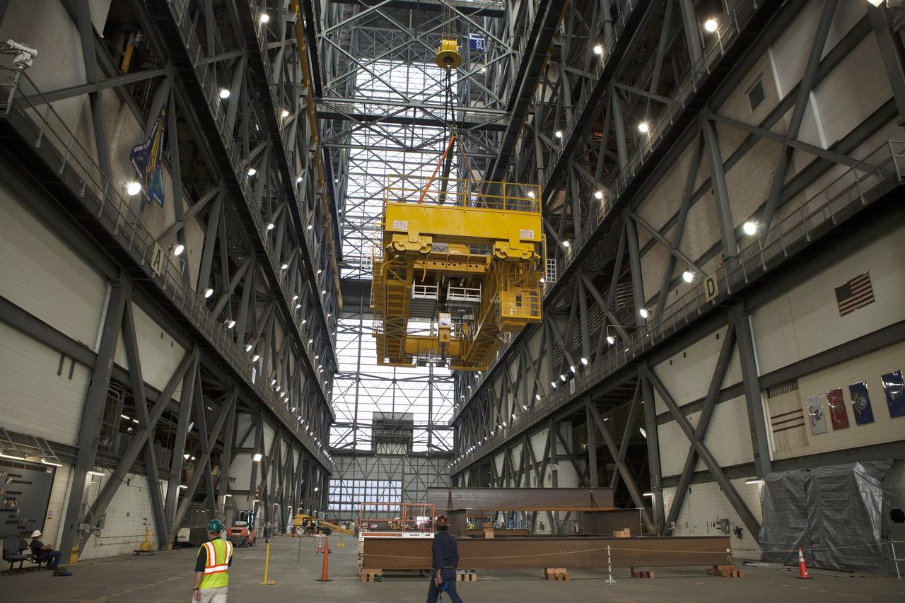 CAPE CANAVERAL, Fla. – Inside the Vehicle Assembly Building, or VAB, at NASA's Kennedy Space Center in Florida, the 175-ton crane is lowered closer to the transfer aisle floor. The crane was turned to make it easier to lower it from Level 16. Upgrades to the crane's 45-year-old controls will be performed in order to improve reliability, precision and safety. The Ground Systems Development and Operations Program is overseeing upgrades and modifications to the VAB. The crane will be upgraded so that it can support lifting needs for NASA and other exploration vehicles, including the agency's Space Launch System and Orion spacecraft. Photo credit: NASA/Daniel Casper