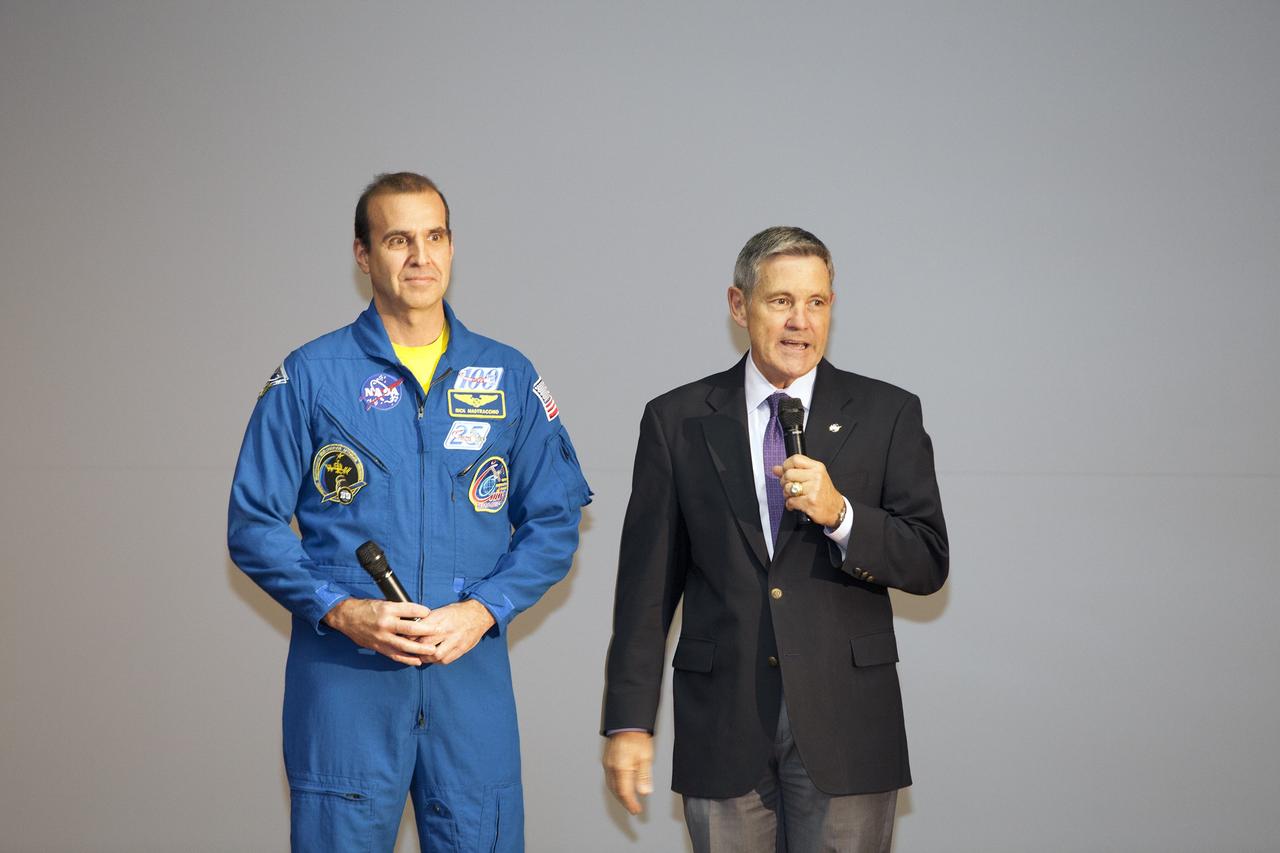 CAPE CANAVERAL, Fla. – NASA Kennedy Space Center Director and former astronaut Bob Cabana, right, introduces astronaut Rick Mastracchio to the audience at a post-flight presentation on the Expedition 38 mission to the International Space Station.    The Space Flight Awareness Program hosted Mastracchio's presentation for employees in the KSC Training Auditorium. An Expedition 38/39 crew member, Mastracchio launched to the station from the Baikonur Cosmodrome in Kazakhstan on Nov. 6, 2013, and returned to Earth on May 13, 2014, after 188 days in space. Following Mastracchio's remarks, employees were given the opportunity to ask questions and to meet him in person. To read Mastracchio's biography, visit http://www.jsc.nasa.gov/Bios/htmlbios/mastracc.html. For more information on Expedition 38, visit http://www.nasa.gov/mission_pages/station/expeditions/expedition38. Photo credit: NASA/Daniel Casper