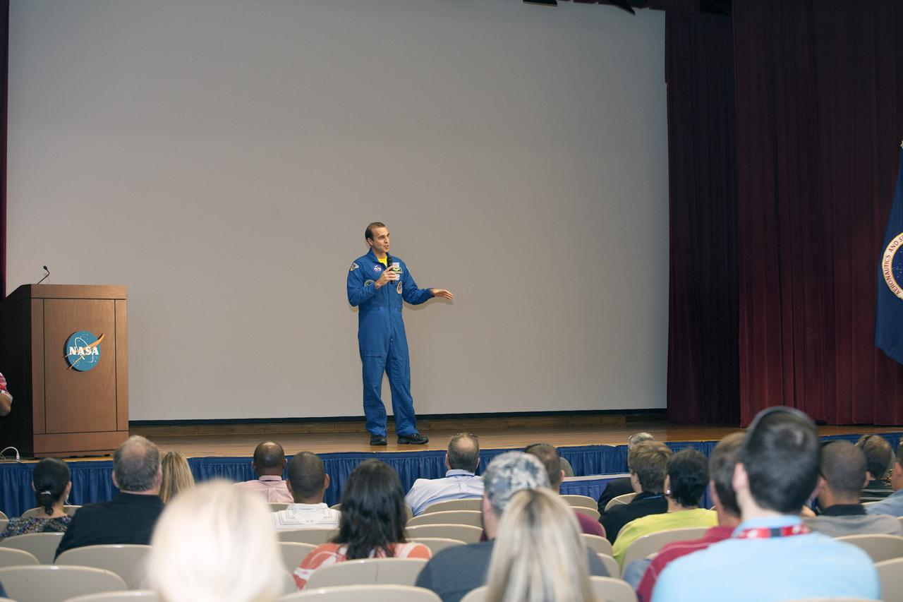 CAPE CANAVERAL, Fla. – NASA astronaut Rick Mastracchio makes his opening remarks to the audience at a post-flight presentation on the Expedition 38 mission to the International Space Station.    The Space Flight Awareness Program hosted Mastracchio's presentation for employees in the KSC Training Auditorium at NASA's Kennedy Space Center in Florida. An Expedition 38/39 crew member, Mastracchio launched to the station from the Baikonur Cosmodrome in Kazakhstan on Nov. 6, 2013, and returned to Earth on May 13, 2014, after 188 days in space. Following Mastracchio's remarks, employees were given the opportunity to ask questions and to meet him in person. To read Mastracchio's biography, visit http://www.jsc.nasa.gov/Bios/htmlbios/mastracc.html. For more information on Expedition 38, visit http://www.nasa.gov/mission_pages/station/expeditions/expedition38. Photo credit: NASA/Daniel Casper