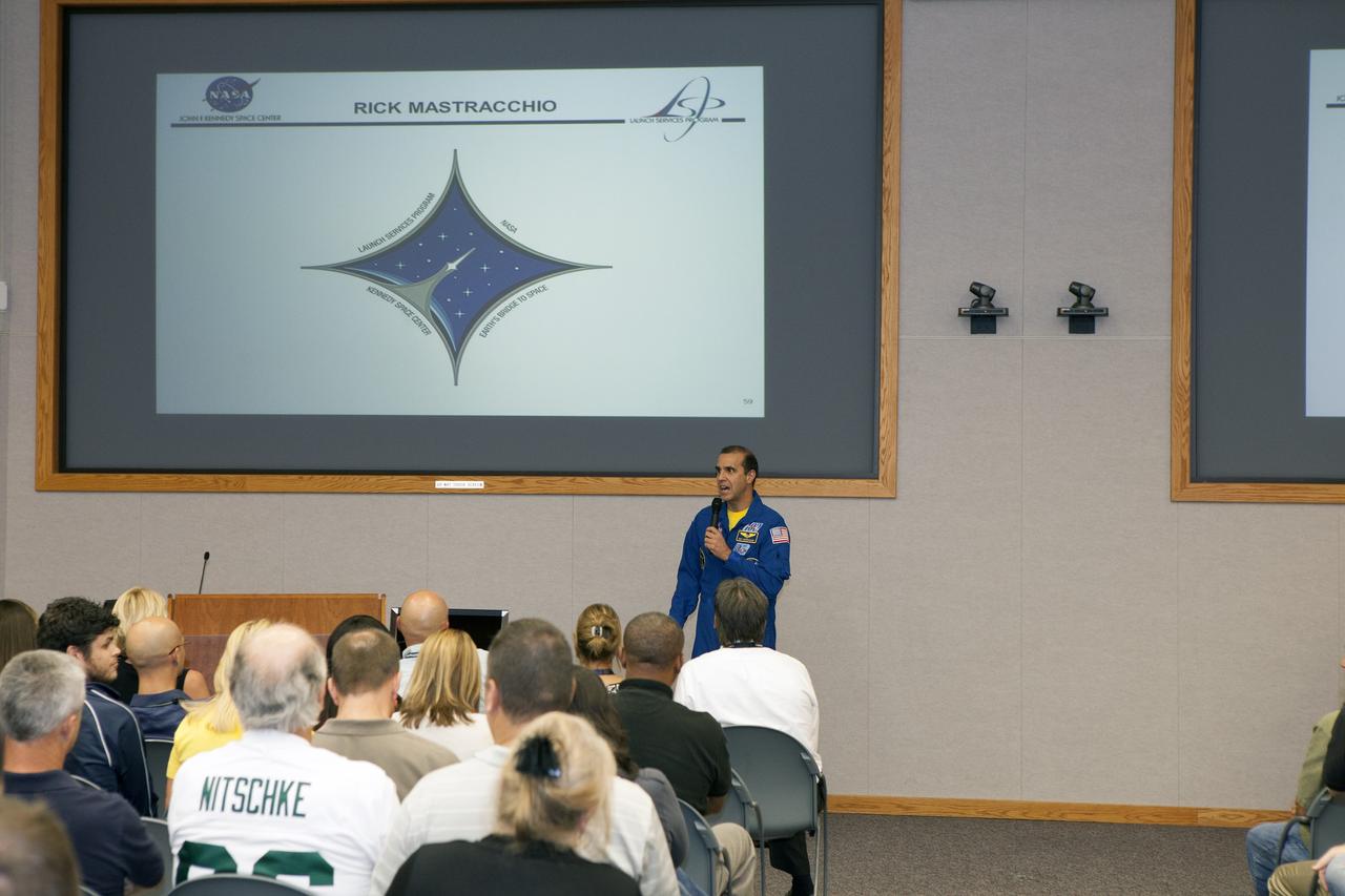 CAPE CANAVERAL, Fla. – NASA astronaut Rick Mastracchio takes questions on the execution of the Slosh experiment from employees attending the Launch Services Program's All Hands meeting in the Neil Armstrong Operations and Checkout Building Mission Briefing Room at NASA's Kennedy Space Center in Florida.    An Expedition 38/39 crew member, Mastracchio launched to the station from the Baikonur Cosmodrome in Kazakhstan on Nov. 6, 2013, and returned to Earth on May 13, 2014, after 188 days in space. To read Mastracchio's biography, visit http://www.jsc.nasa.gov/Bios/htmlbios/mastracc.html. For more information on the Slosh experiment, visit http://www.nasa.gov/content/slosh-experiment-designed-to-improve-rocket-safety-efficiency/. Photo credit: NASA/Daniel Casper