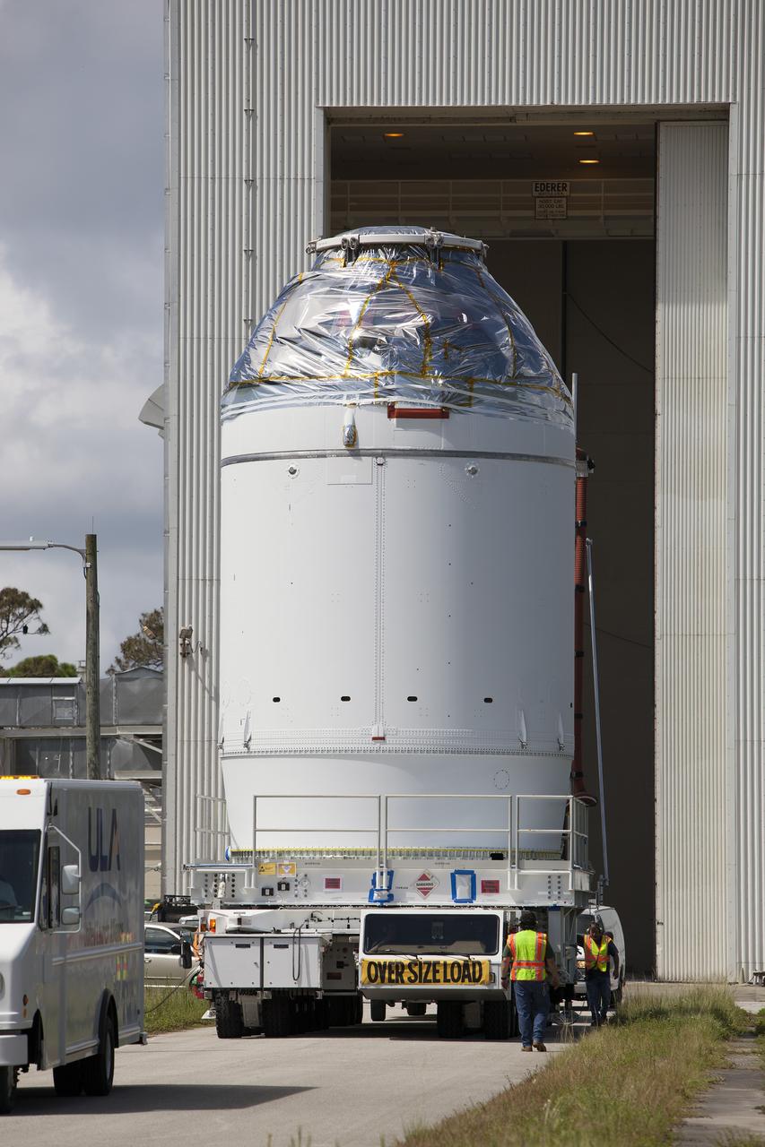 CAPE CANAVERAL, Fla. – The Orion crew module, stacked atop its service module, begins its move from the Payload Hazardous Servicing Facility, or PHSF, to the Launch Abort System Facility, or LASF, at NASA's Kennedy Space Center in Florida. The spacecraft for Exploration Flight Test-1 was fueled in the PHSF. Inside the LASF, the Launch Abort System will be installed around the Orion spacecraft ahead of its December flight test.       Orion is the exploration spacecraft designed to carry astronauts to destinations not yet explored by humans, including an asteroid and Mars. It will have emergency abort capability, sustain the crew during space travel and provide safe re-entry from deep space return velocities. The first unpiloted test flight of the Orion is scheduled to launch atop a United Launch Alliance Delta IV Heavy rocket from Cape Canaveral Air Force Station in Florida to an altitude of 3,600 miles above the Earth's surface. The two-orbit, four-hour flight test will help engineers evaluate the systems critical to crew safety including the heat shield, parachute system and launch abort system. For more information, visit http://www.nasa.gov/orion. Photo credit: NASA/Dimitri Gerondidakis