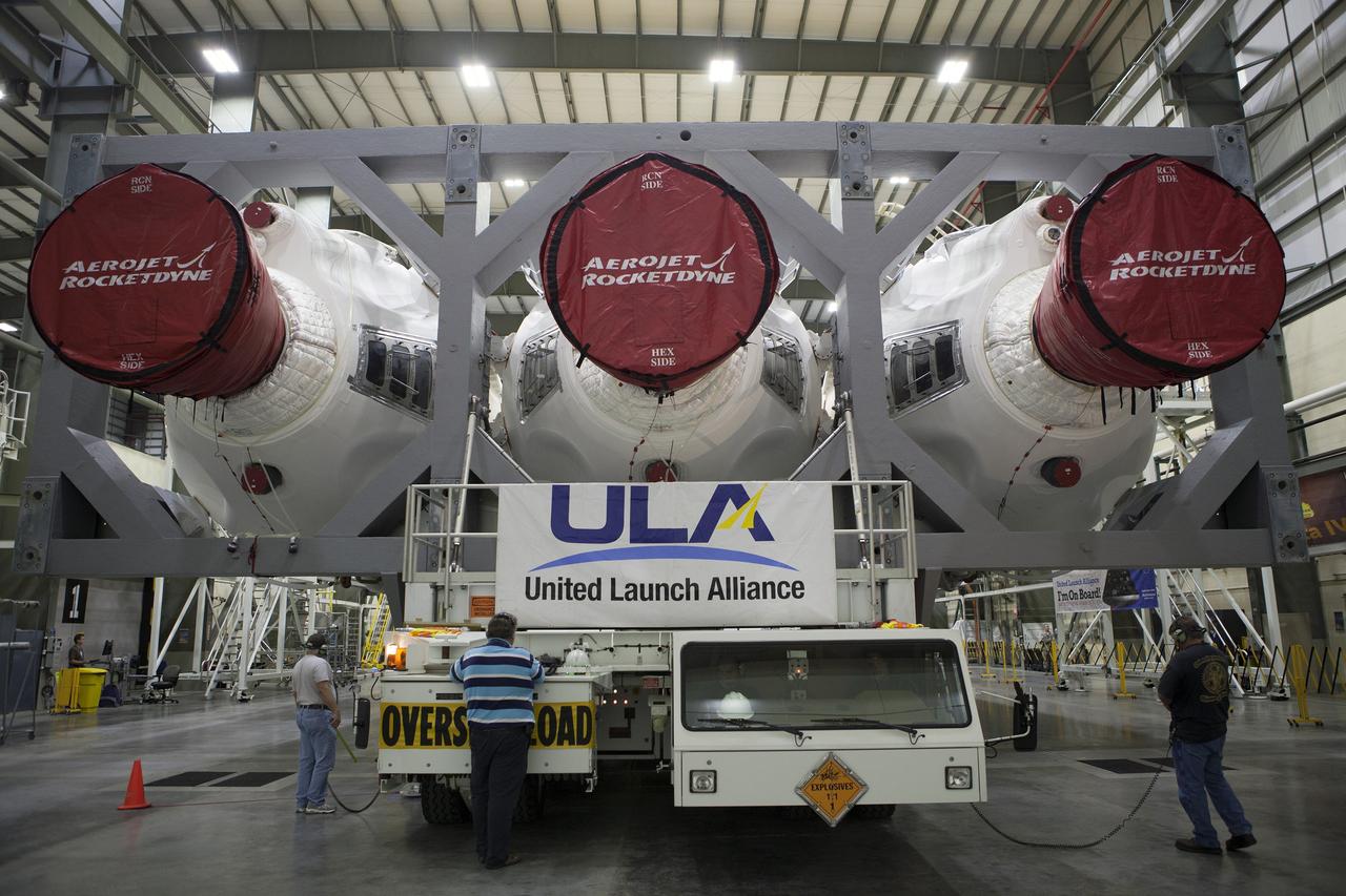 CAPE CANAVERAL, Fla. – Inside the Horizontal Integration Facility at Space Launch Complex 37 at Cape Canaveral Air Force Station in Florida, United Launch Alliance technicians prepare the Delta IV Heavy rocket for rollout to the pad. The rocket is secured on the Elevated Platform Transporter for the trip to the pad. The Delta IV Heavy will launch Orion on Exploration Flight Test-1. During its first flight test, Orion will travel farther into space than any human spacecraft has gone in more than 40 years. The data gathered during the flight will influence design decisions, validate existing computer models and innovative new approaches to space systems development, as well as reduce overall mission risks and costs for later Orion flights. Liftoff of Orion on the first flight test is planned for December 2014. Photo credit: NASA/Dimitri Gerondidakis