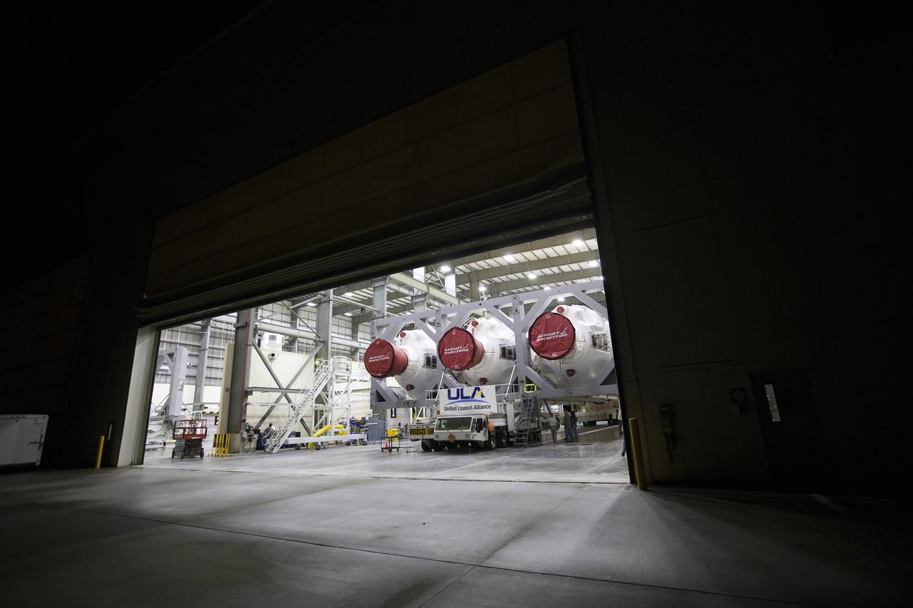CAPE CANAVERAL, Fla. – Inside the Horizontal Integration Facility at Space Launch Complex 37 at Cape Canaveral Air Force Station in Florida, the Delta IV Heavy rocket is ready for rollout to the pad. The rocket is secured on the Elevated Platform Transporter for the trip to the pad. The Delta IV Heavy will launch Orion on Exploration Flight Test-1. During its first flight test, Orion will travel farther into space than any human spacecraft has gone in more than 40 years. The data gathered during the flight will influence design decisions, validate existing computer models and innovative new approaches to space systems development, as well as reduce overall mission risks and costs for later Orion flights. Liftoff of Orion on the first flight test is planned for December 2014. Photo credit: NASA/Dimitri Gerondidakis