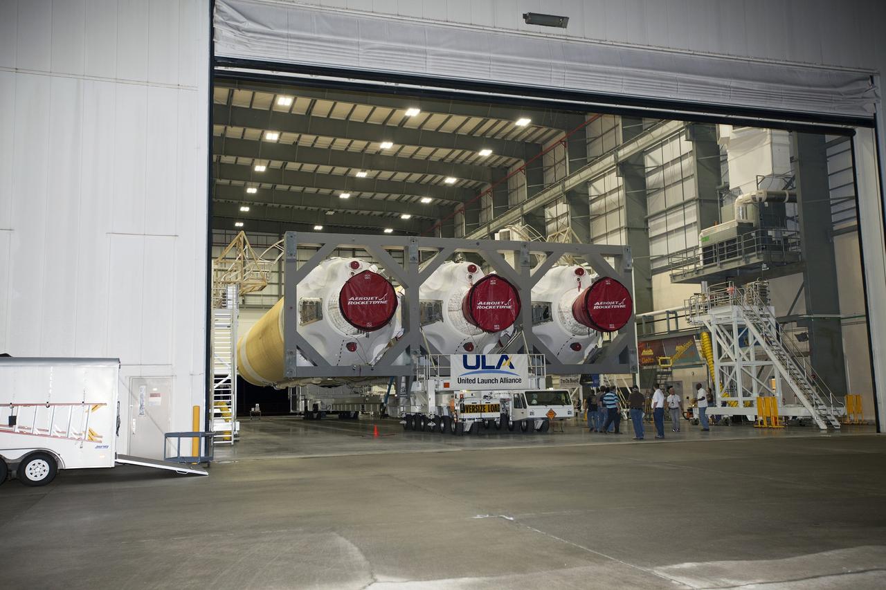 CAPE CANAVERAL, Fla. – Inside the Horizontal Integration Facility at Space Launch Complex 37 at Cape Canaveral Air Force Station in Florida, United Launch Alliance technicians and engineers prepare the Delta IV Heavy rocket for rollout to the pad. The rocket is secured on the Elevated Platform Transporter for the trip to the pad. The Delta IV Heavy will launch Orion on Exploration Flight Test-1. During its first flight test, Orion will travel farther into space than any human spacecraft has gone in more than 40 years. The data gathered during the flight will influence design decisions, validate existing computer models and innovative new approaches to space systems development, as well as reduce overall mission risks and costs for later Orion flights. Liftoff of Orion on the first flight test is planned for December 2014. Photo credit: NASA/Dimitri Gerondidakis