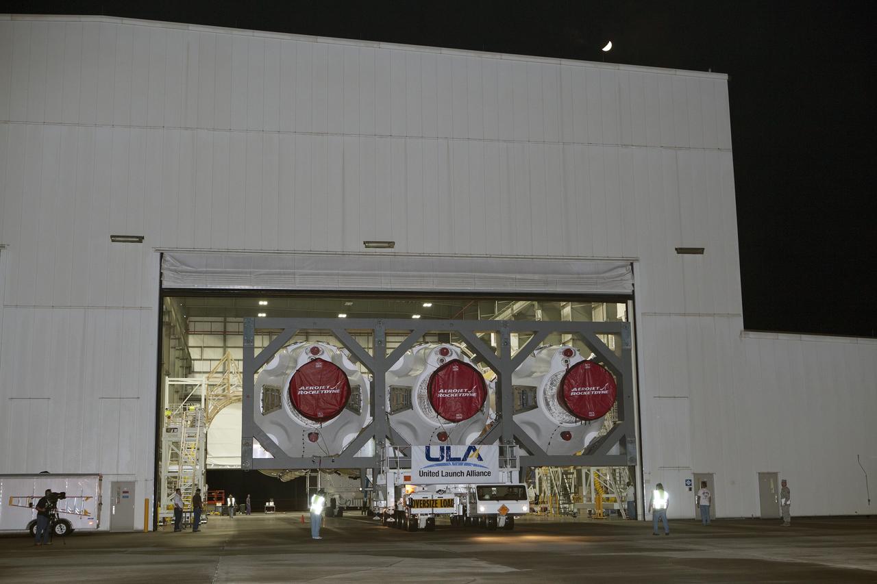 CAPE CANAVERAL, Fla. – The United Launch Alliance Delta IV Heavy rocket begins to rollout from the Horizontal Integration Facility at Space Launch Complex 37 at Cape Canaveral Air Force Station in Florida. The rocket is secured on the Elevated Platform Transporter for the trip to the pad. The Delta IV Heavy will launch Orion on Exploration Flight Test-1. During its first flight test, Orion will travel farther into space than any human spacecraft has gone in more than 40 years. The data gathered during the flight will influence design decisions, validate existing computer models and innovative new approaches to space systems development, as well as reduce overall mission risks and costs for later Orion flights. Liftoff of Orion on the first flight test is planned for December 2014. Photo credit: NASA/Dimitri Gerondidakis
