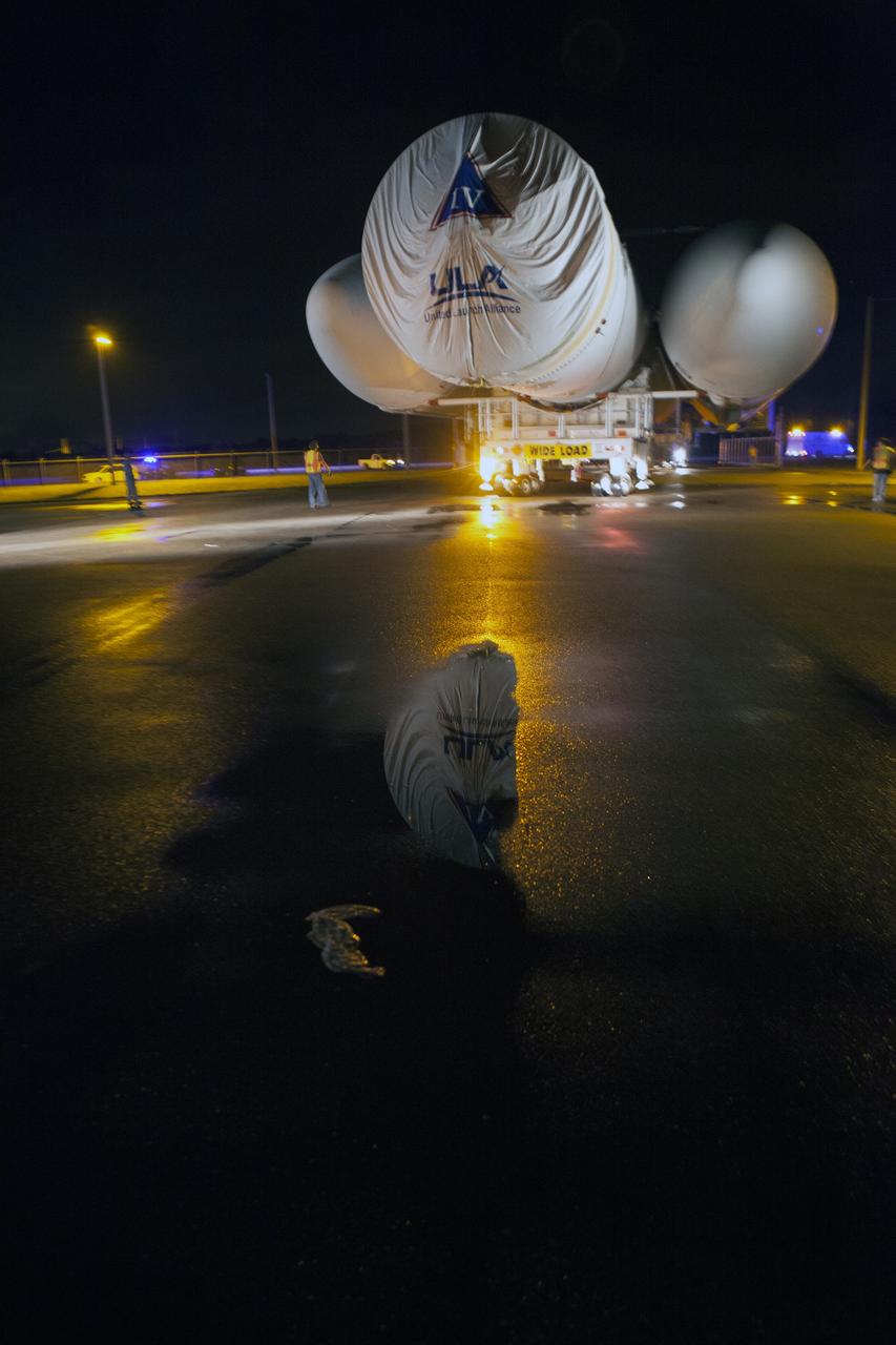 CAPE CANAVERAL, Fla. – The United Launch Alliance, or ULA, Delta IV Heavy rocket has exited the Horizontal Integration Facility at Space Launch Complex 37 at Cape Canaveral Air Force Station in Florida. ULA technicians help guide the rocket, secured on the Elevated Platform Transporter, for the trip to the pad. The Delta IV Heavy will launch Orion on Exploration Flight Test-1. During its first flight test, Orion will travel farther into space than any human spacecraft has gone in more than 40 years. The data gathered during the flight will influence design decisions, validate existing computer models and innovative new approaches to space systems development, as well as reduce overall mission risks and costs for later Orion flights. Liftoff of Orion on the first flight test is planned for December 2014. Photo credit: NASA/Dimitri Gerondidakis