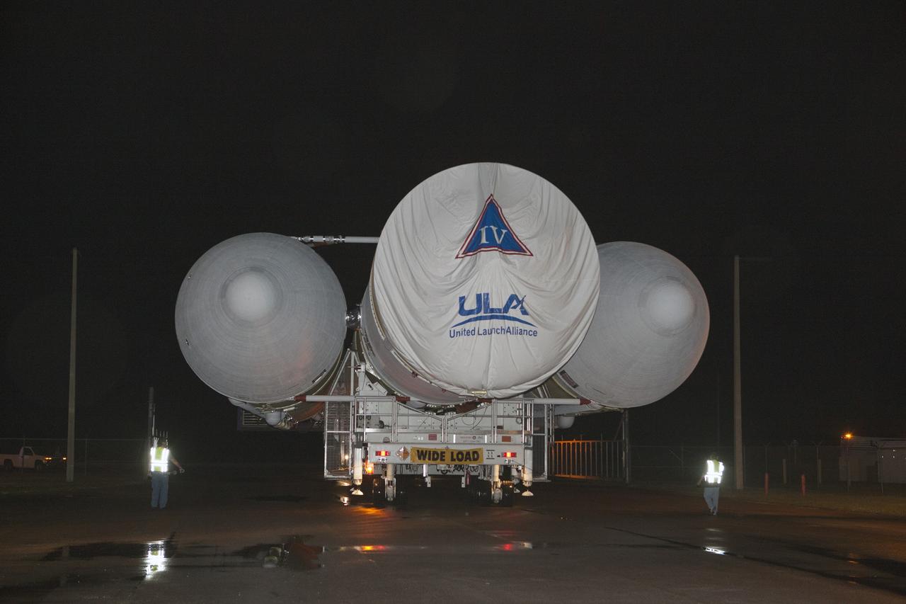 CAPE CANAVERAL, Fla. – The United Launch Alliance, or ULA, Delta IV Heavy rocket has exited the Horizontal Integration Facility at Space Launch Complex 37 at Cape Canaveral Air Force Station in Florida. ULA technicians help guide the rocket, secured on the Elevated Platform Transporter, for the trip to the pad. The Delta IV Heavy will launch Orion on Exploration Flight Test-1. During its first flight test, Orion will travel farther into space than any human spacecraft has gone in more than 40 years. The data gathered during the flight will influence design decisions, validate existing computer models and innovative new approaches to space systems development, as well as reduce overall mission risks and costs for later Orion flights. Liftoff of Orion on the first flight test is planned for December 2014. Photo credit: NASA/Dimitri Gerondidakis
