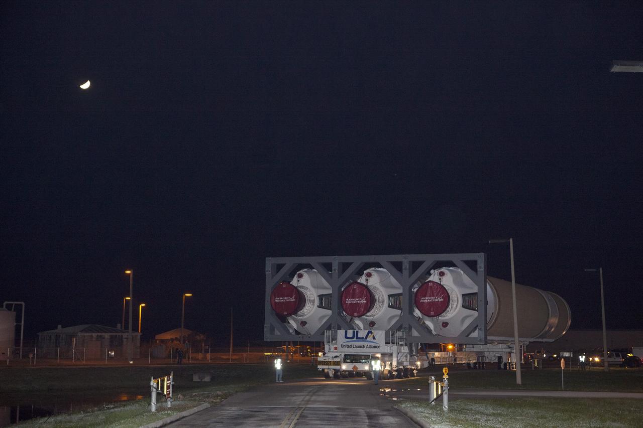 CAPE CANAVERAL, Fla. – A United Launch Alliance technicians drives the transporter that carries the Delta IV Heavy rocket to the pad at Space Launch Complex 37 at Cape Canaveral Air Force Station in Florida. The rocket is secured on the Elevated Platform Transporter. The Delta IV Heavy will launch Orion on Exploration Flight Test-1. During its first flight test, Orion will travel farther into space than any human spacecraft has gone in more than 40 years. The data gathered during the flight will influence design decisions, validate existing computer models and innovative new approaches to space systems development, as well as reduce overall mission risks and costs for later Orion flights. Liftoff of Orion on the first flight test is planned for December 2014. Photo credit: NASA/Dimitri Gerondidakis