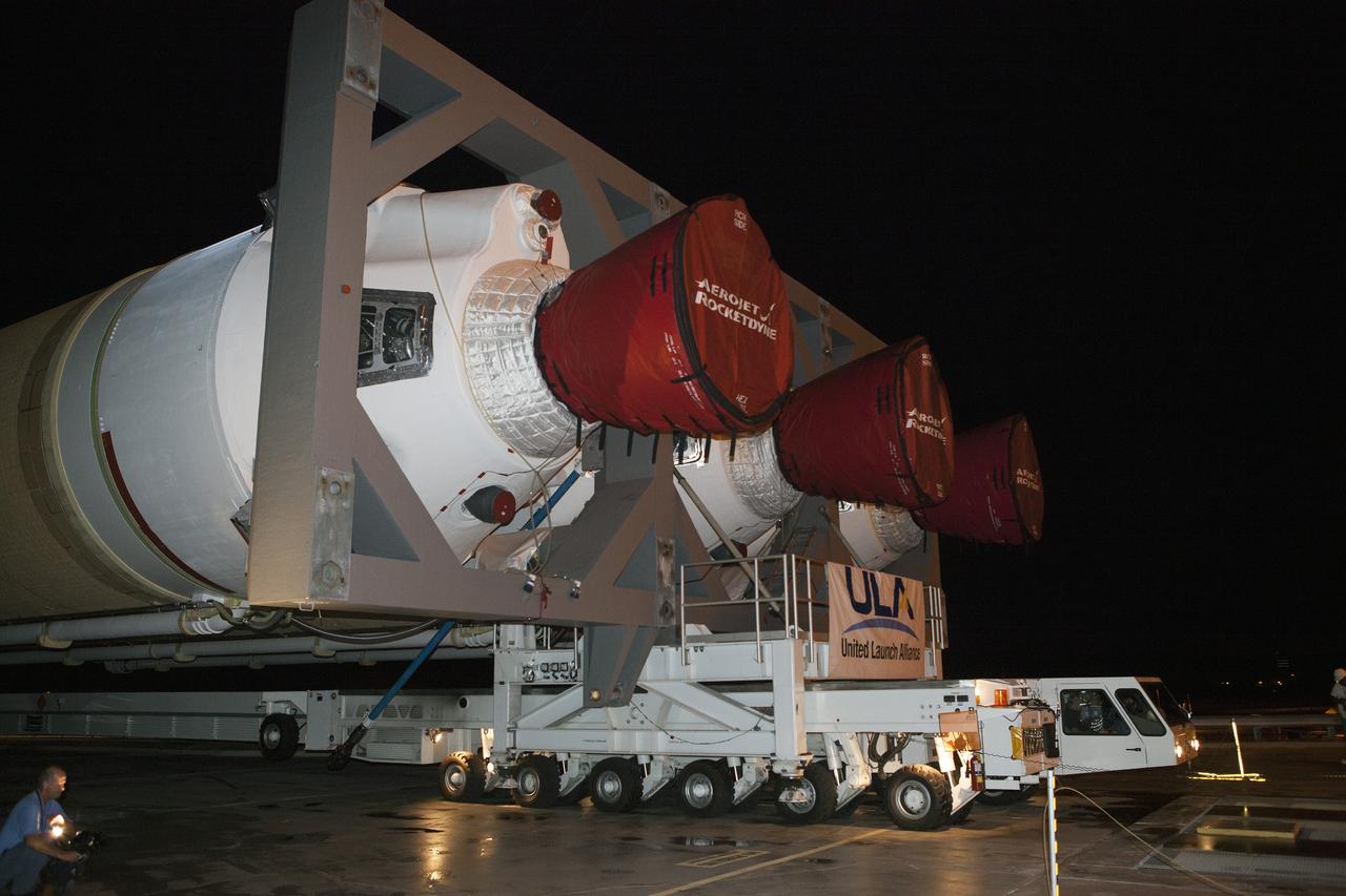 CAPE CANAVERAL, Fla. – A United Launch Alliance technicians drives the transporter that carries the Delta IV Heavy rocket to the pad at Space Launch Complex 37 at Cape Canaveral Air Force Station in Florida. The rocket is secured on the Elevated Platform Transporter. The Delta IV Heavy will launch Orion on Exploration Flight Test-1. During its first flight test, Orion will travel farther into space than any human spacecraft has gone in more than 40 years. The data gathered during the flight will influence design decisions, validate existing computer models and innovative new approaches to space systems development, as well as reduce overall mission risks and costs for later Orion flights. Liftoff of Orion on the first flight test is planned for December 2014. Photo credit: NASA/Dimitri Gerondidakis