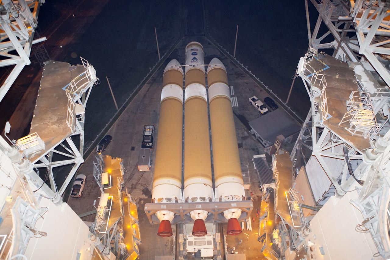 CAPE CANAVERAL, Fla. – The United Launch Alliance Delta IV Heavy rocket for Exploration Flight Test-1 arrives at the pad at Space Launch Complex 37 at Cape Canaveral Air Force Station in Florida. The rocket is secured on the Elevated Platform Transporter. The Delta IV Heavy will launch Orion on its first flight test. During its first flight test, Orion will travel farther into space than any human spacecraft has gone in more than 40 years. The data gathered during the flight will influence design decisions, validate existing computer models and innovative new approaches to space systems development, as well as reduce overall mission risks and costs for later Orion flights. Liftoff of Orion on the first flight test is planned for December 2014. Photo credit: NASA/Dimitri Gerondidakis