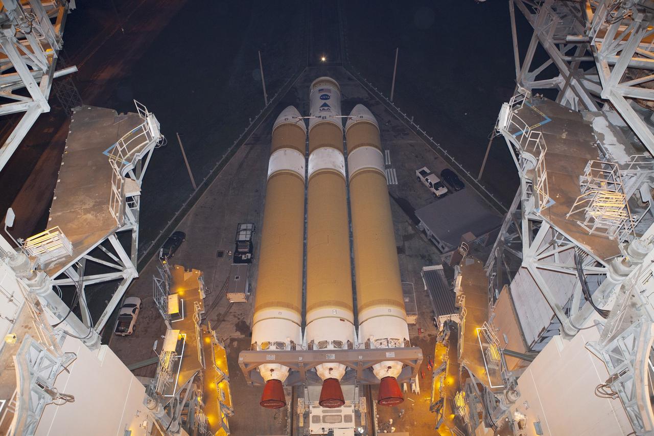 CAPE CANAVERAL, Fla. – The United Launch Alliance Delta IV Heavy rocket for Exploration Flight Test-1 has arrived at the pad at Space Launch Complex 37 at Cape Canaveral Air Force Station in Florida. The rocket is secured on the Elevated Platform Transporter. The Delta IV Heavy will launch Orion on its first flight test. During its first flight test, Orion will travel farther into space than any human spacecraft has gone in more than 40 years. The data gathered during the flight will influence design decisions, validate existing computer models and innovative new approaches to space systems development, as well as reduce overall mission risks and costs for later Orion flights. Liftoff of Orion on the first flight test is planned for December 2014. Photo credit: NASA/Dimitri Gerondidakis