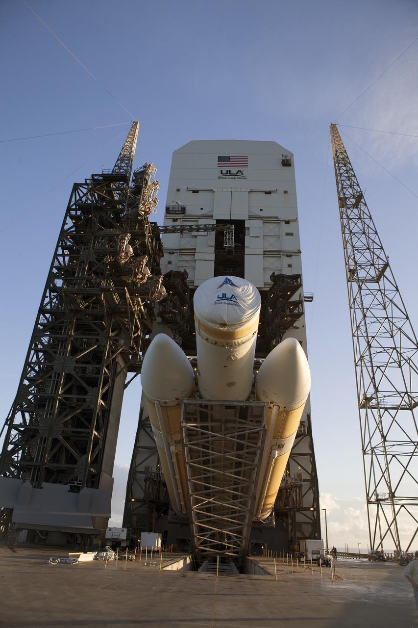 CAPE CANAVERAL, Fla. – The United Launch Alliance Delta IV Heavy rocket for Exploration Flight Test-1 is being lifted to the vertical position at the pad at Space Launch Complex 37 at Cape Canaveral Air Force Station in Florida. The Delta IV Heavy is being readied to launch Orion on its first flight test. During its first flight test, Orion will travel farther into space than any human spacecraft has gone in more than 40 years. The data gathered during the flight will influence design decisions, validate existing computer models and innovative new approaches to space systems development, as well as reduce overall mission risks and costs for later Orion flights. Liftoff of Orion on the first flight test is planned for December 2014. Photo credit: NASA/Daniel Casper