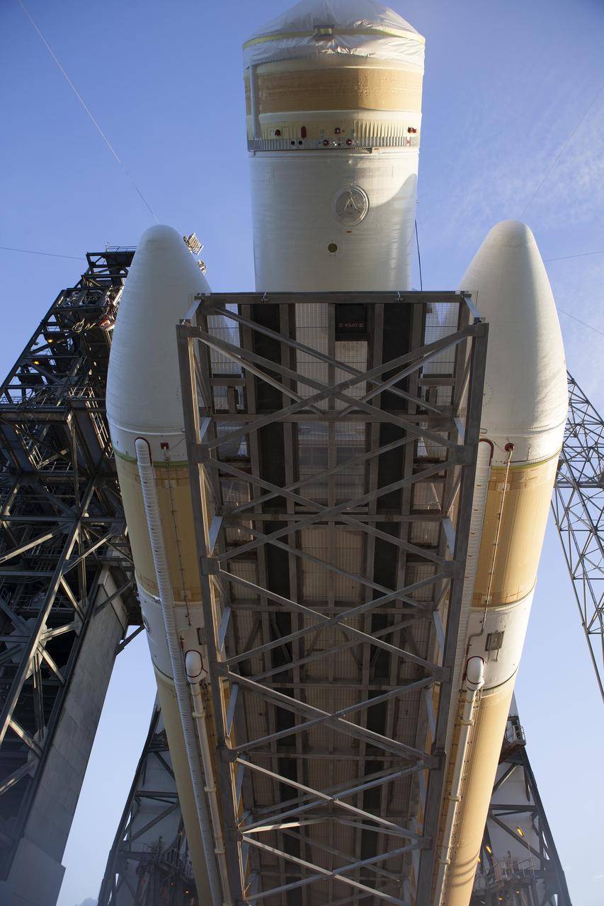 CAPE CANAVERAL, Fla. – This close-up view shows the United Launch Alliance Delta IV Heavy rocket for Exploration Flight Test-1 being raised into the vertical position at the pad at Space Launch Complex 37 at Cape Canaveral Air Force Station in Florida. The Delta IV Heavy is being readied to launch Orion on its first flight test. During its first flight test, Orion will travel farther into space than any human spacecraft has gone in more than 40 years. The data gathered during the flight will influence design decisions, validate existing computer models and innovative new approaches to space systems development, as well as reduce overall mission risks and costs for later Orion flights. Liftoff of Orion on the first flight test is planned for December 2014. Photo credit: NASA/Daniel Casper