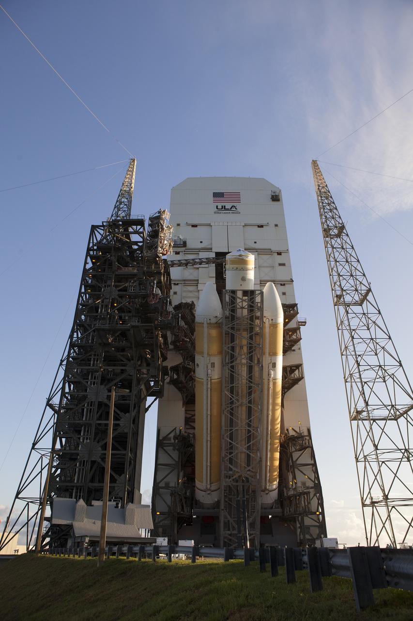 CAPE CANAVERAL, Fla. – The United Launch Alliance Delta IV Heavy rocket for Exploration Flight Test-1 is being lifted to the vertical position in the mobile service tower on the pad at the pad at Space Launch Complex 37 at Cape Canaveral Air Force Station in Florida. The Delta IV Heavy is being readied to launch Orion on its first flight test. During its first flight test, Orion will travel farther into space than any human spacecraft has gone in more than 40 years. The data gathered during the flight will influence design decisions, validate existing computer models and innovative new approaches to space systems development, as well as reduce overall mission risks and costs for later Orion flights. Liftoff of Orion on the first flight test is planned for December 2014. Photo credit: NASA/Daniel Casper
