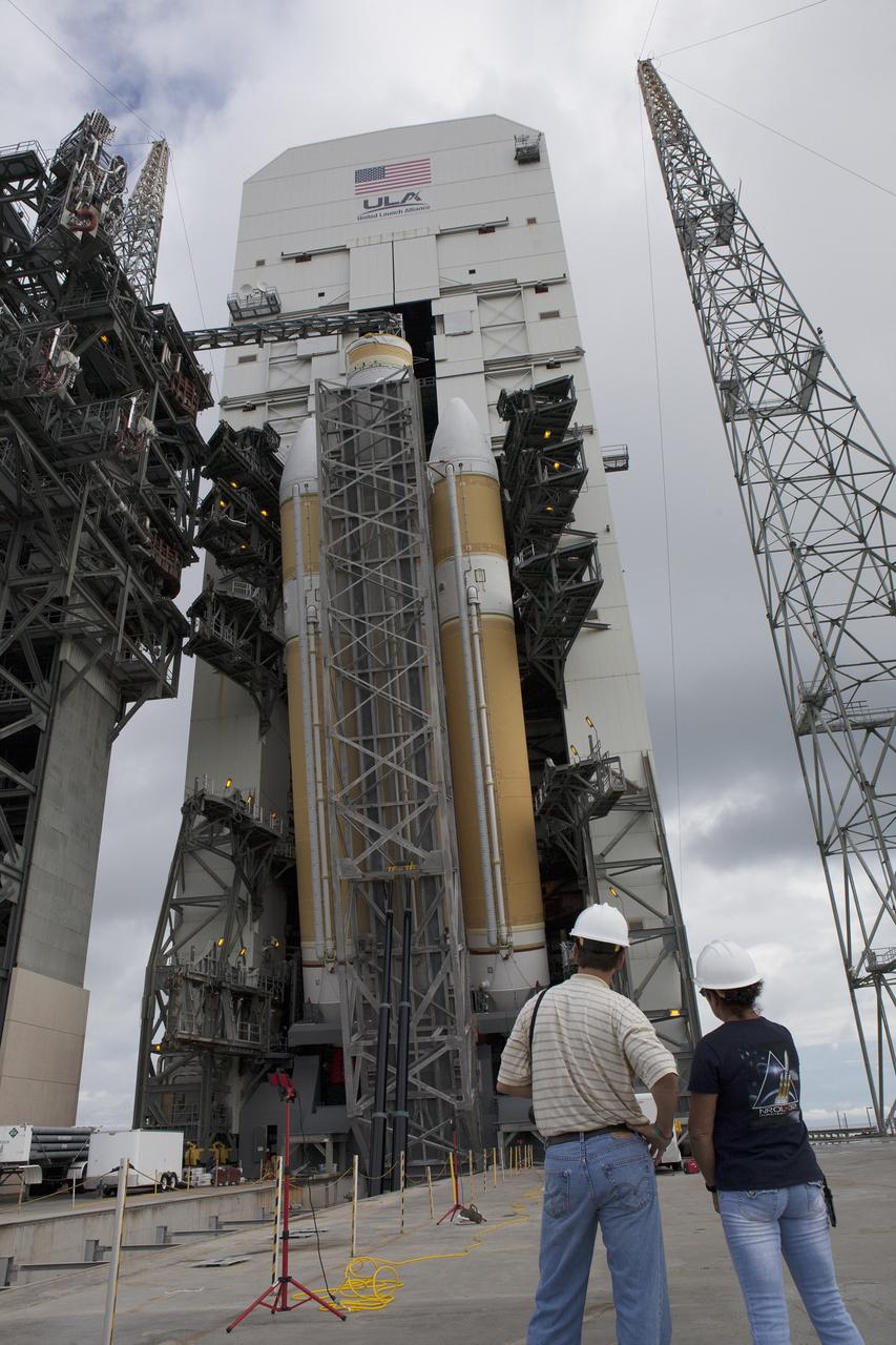 CAPE CANAVERAL, Fla. – United Launch Alliance, or ULA, workers monitor the progress as the ULA Delta IV Heavy rocket for Exploration Flight Test-1 is lifted to the vertical position in the mobile service tower on the pad at Space Launch Complex 37 at Cape Canaveral Air Force Station in Florida. The Delta IV Heavy is being readied to launch Orion on its first flight test. During its first flight test, Orion will travel farther into space than any human spacecraft has gone in more than 40 years. The data gathered during the flight will influence design decisions, validate existing computer models and innovative new approaches to space systems development, as well as reduce overall mission risks and costs for later Orion flights. Liftoff of Orion on the first flight test is planned for December 2014. Photo credit: NASA/Daniel Casper