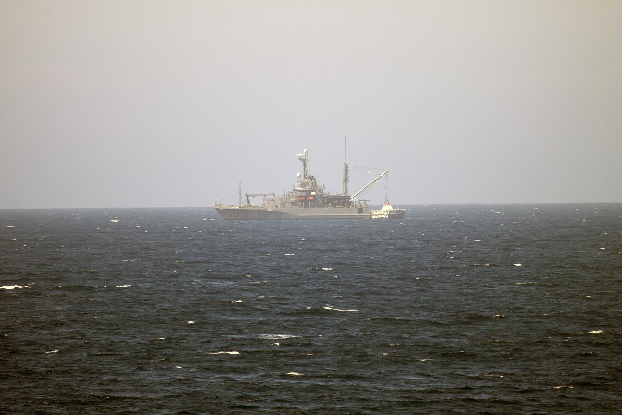 SAN DIEGO, Calif. – During Orion Underway Recovery Test 4A aboard the USNS Salvor, a safeguard-class rescue and salvage ship, a crane is used to lift the Orion boilerplate test vehicle. Orion will be lifted up and lowered into the water to test crew module crane recovery operations. NASA, Lockheed Martin and the U.S. Navy are conducting the test in the Pacific Ocean to prepare for recovery of the Orion crew module on its return from a deep space mission. The test allows the teams to demonstrate and evaluate the recovery processes, procedures, hardware and personnel in open waters. The Ground Systems Development and Operations Program is conducting the underway recovery tests. Orion is the exploration spacecraft designed to carry astronauts to destinations not yet explored by humans, including an asteroid and Mars. It will have emergency abort capability, sustain the crew during space travel and provide safe re-entry from deep space return velocities. The first unpiloted test flight of Orion is scheduled to launch in 2014 atop a United Launch Alliance Delta IV Heavy rocket and in 2018 on NASA’s Space Launch System rocket. For more information, visit http://www.nasa.gov/orion. Photo credit: NASA/Cory Huston