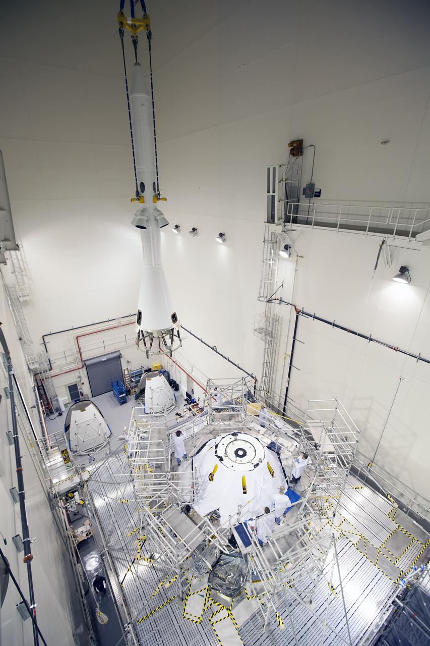 CAPE CANAVERAL, Fla. – A crane is used to lift and move the launch abort system for installation on the Orion spacecraft for Exploration Flight Test-1 inside the Launch Abort System Facility, or LASF, at NASA's Kennedy Space Center in Florida. The completed crew and service modules will be tested and verified together with the launch abort system. Orion will remain inside the LASF until mid-November, when the United Launch Alliance Delta IV Heavy rocket is ready for integration with the spacecraft. Orion is the exploration spacecraft designed to carry astronauts to destinations not yet explored by humans, including an asteroid and Mars. It will have emergency abort capability, sustain the crew during space travel and provide safe re-entry from deep space return velocities. The first unpiloted test flight of the Orion is scheduled to launch in December atop the Delta IV Heavy rocket from Cape Canaveral Air Force Station in Florida to an altitude of 3,600 miles above the Earth's surface. The two-orbit, four-hour flight test will help engineers evaluate the systems critical to crew safety including the heat shield, parachute system and launch abort system. For more information, visit http://www.nasa.gov/orion. Photo credit: NASA/Cory Huston