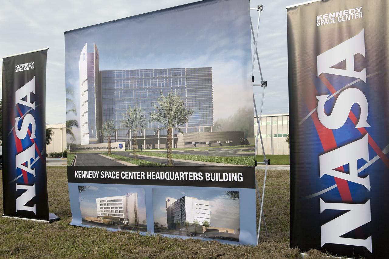 CAPE CANAVERAL, Fla. – Groundbreaking for the new Central Campus will take place in the Industrial Area at NASA's Kennedy Space Center in Florida. NASA banners and an artist rendering of the new facility have been set up for the ceremony.    Kennedy is transforming into a multi-user, 21st century spaceport supporting both commercial and government users and operations. Central Campus Phase I includes construction of a new Headquarters Building as one of the major components of the strategy. The new Headquarters Building will be a seven-story, 200,000-square-foot facility that will house about 500 NASA civil service and contractor employees. Photo credit: NASA/Kim Shiflett