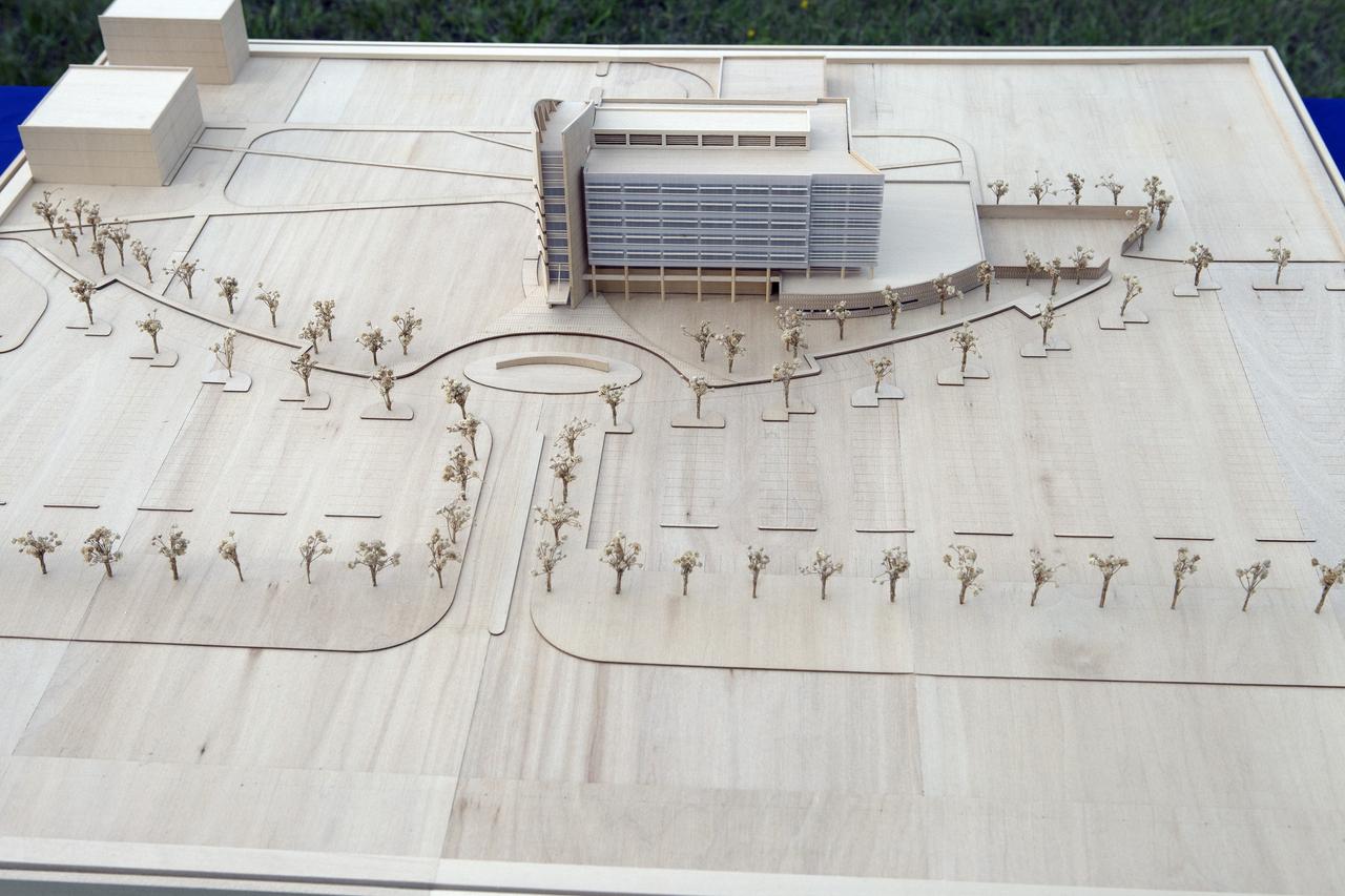 CAPE CANAVERAL, Fla. – Groundbreaking for the new Central Campus will take place in the Industrial Area at NASA's Kennedy Space Center in Florida. A scale model of the new facility and landscaping is on display for the ceremony. Kennedy is transforming into a multi-user, 21st century spaceport supporting both commercial and government users and operations. Central Campus Phase I includes construction of a new Headquarters Building as one of the major components of the strategy. The new Headquarters Building will be a seven-story, 200,000-square-foot facility that will house about 500 NASA civil service and contractor employees. Photo credit: NASA/Kim Shiflett