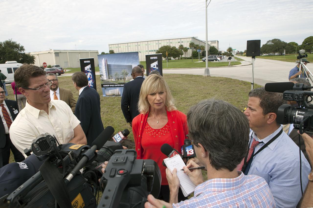 CAPE CANAVERAL, Fla. – Groundbreaking for the new Central Campus will take place in the Industrial Area at NASA's Kennedy Space Center in Florida. Nancy Bray, director of Kennedy's Center Operations Directorate, is interviewed by members of the media during the groundbreaking ceremony. Kennedy is transforming into a multi-user, 21st century spaceport supporting both commercial and government users and operations. Central Campus Phase I includes construction of a new Headquarters Building as one of the major components of the strategy. The new Headquarters Building will be a seven-story, 200,000-square-foot facility that will house about 500 NASA civil service and contractor employees. Photo credit: NASA/Kim Shiflett