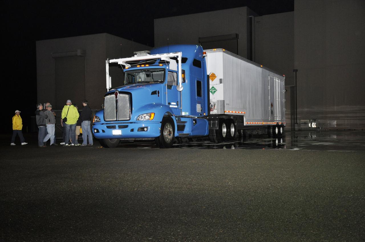 VANDENBERG AIR FORCE BASE, Calif. – The truck transporting NASA's Soil Moisture Active Passive, or SMAP, spacecraft arrives at the Astrotech payload processing facility on Vandenberg Air Force Base in California. SMAP will launch on a Delta II 7320 configuration vehicle featuring a United Launch Alliance first stage booster powered by an Aerojet Rocketdyne RS-27A main engine and three Alliant Techsystems, or ATK, strap-on solid rocket motors. Once on station in Earth orbit, SMAP will provide global measurements of soil moisture and its freeze/thaw state. These measurements will be used to enhance understanding of processes that link the water, energy and carbon cycles, and to extend the capabilities of weather and climate prediction models. SMAP data also will be used to quantify net carbon flux in boreal landscapes and to develop improved flood prediction and drought monitoring capabilities. Launch from Space Launch Complex 2 is targeted for Jan. 29, 2015. To learn more about SMAP, visit http://smap.jpl.nasa.gov. Photo credit: NASA/Randy Beaudoin