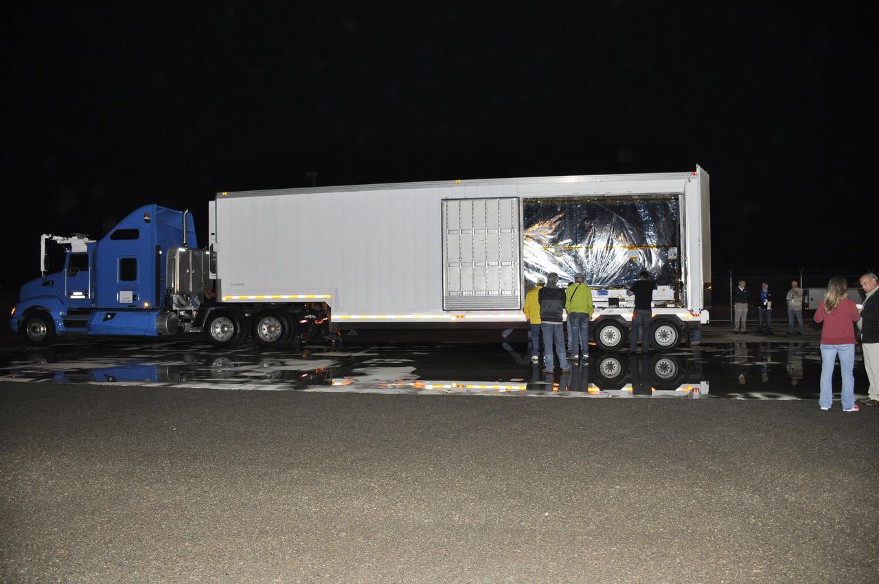 VANDENBERG AIR FORCE BASE, Calif. – Operations are underway to offload NASA's Soil Moisture Active Passive, or SMAP, spacecraft from the truck that delivered it from the Jet Propulsion Laboratory in Pasadena, California, to the Astrotech payload processing facility on Vandenberg Air Force Base in California.    SMAP will launch on a Delta II 7320 configuration vehicle featuring a United Launch Alliance first stage booster powered by an Aerojet Rocketdyne RS-27A main engine and three Alliant Techsystems, or ATK, strap-on solid rocket motors. Once on station in Earth orbit, SMAP will provide global measurements of soil moisture and its freeze/thaw state. These measurements will be used to enhance understanding of processes that link the water, energy and carbon cycles, and to extend the capabilities of weather and climate prediction models. SMAP data also will be used to quantify net carbon flux in boreal landscapes and to develop improved flood prediction and drought monitoring capabilities. Launch from Space Launch Complex 2 is targeted for Jan. 29, 2015. To learn more about SMAP, visit http://smap.jpl.nasa.gov.  Photo credit: NASA/Randy Beaudoin