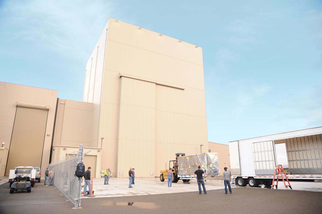 VANDENBERG AIR FORCE BASE, Calif. – NASA's Soil Moisture Active Passive, or SMAP, spacecraft, enclosed in a transportation container, is offloaded from the truck on which it traveled from the Jet Propulsion Laboratory in Pasadena, California, to the Astrotech payload processing facility on Vandenberg Air Force Base in California.    SMAP will launch on a Delta II 7320 configuration vehicle featuring a United Launch Alliance first stage booster powered by an Aerojet Rocketdyne RS-27A main engine and three Alliant Techsystems, or ATK, strap-on solid rocket motors. Once on station in Earth orbit, SMAP will provide global measurements of soil moisture and its freeze/thaw state. These measurements will be used to enhance understanding of processes that link the water, energy and carbon cycles, and to extend the capabilities of weather and climate prediction models. SMAP data also will be used to quantify net carbon flux in boreal landscapes and to develop improved flood prediction and drought monitoring capabilities. Launch from Space Launch Complex 2 is targeted for Jan. 29, 2015. To learn more about SMAP, visit http://smap.jpl.nasa.gov.  Photo credit: NASA/Robert Rasmison