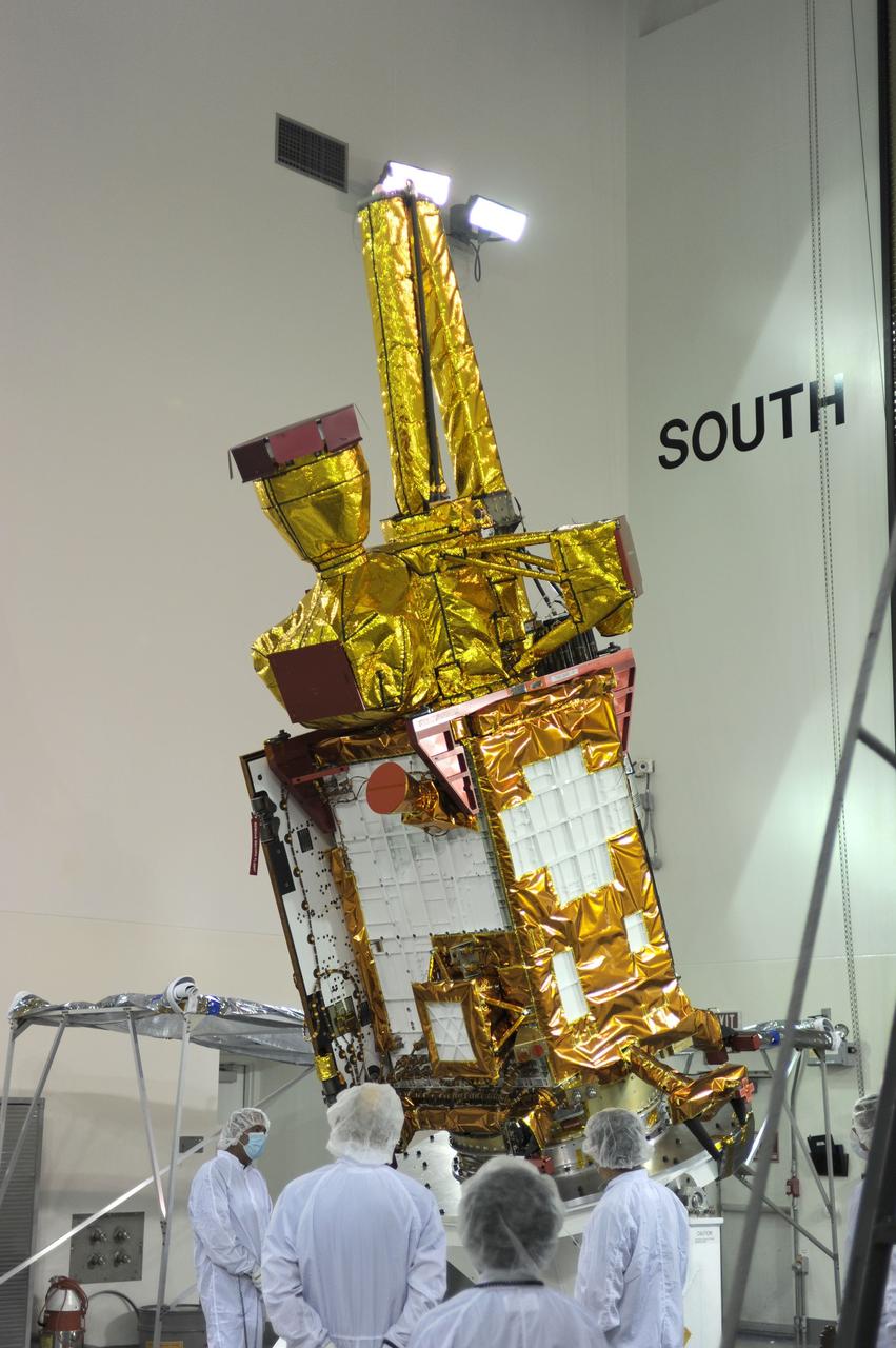 VANDENBERG AIR FORCE BASE, Calif. – Inside the Astrotech payload processing facility on Vandenberg Air Force Base in California, engineers and technicians rotate NASA's Soil Moisture Active Passive, or SMAP, spacecraft to begin processing.    SMAP will launch on a Delta II 7320 configuration vehicle featuring a United Launch Alliance first stage booster powered by an Aerojet Rocketdyne RS-27A main engine and three Alliant Techsystems, or ATK, strap-on solid rocket motors. Once on station in Earth orbit, SMAP will provide global measurements of soil moisture and its freeze/thaw state. These measurements will be used to enhance understanding of processes that link the water, energy and carbon cycles, and to extend the capabilities of weather and climate prediction models. SMAP data also will be used to quantify net carbon flux in boreal landscapes and to develop improved flood prediction and drought monitoring capabilities. Launch from Space Launch Complex 2 is targeted for Jan. 29, 2015. To learn more about SMAP, visit http://smap.jpl.nasa.gov Photo credit: NASA/ Robert Rasmison