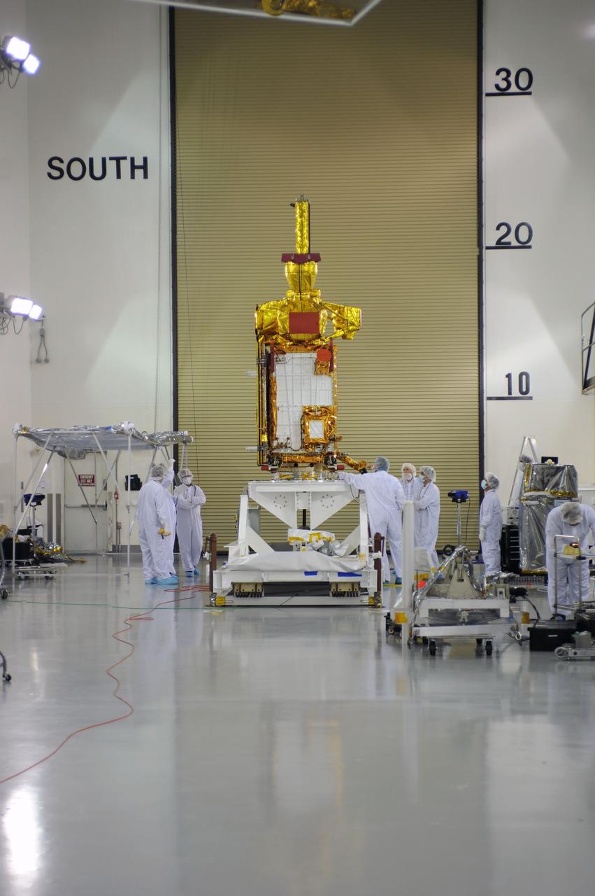 VANDENBERG AIR FORCE BASE, Calif. – Inside the Astrotech payload processing facility on Vandenberg Air Force Base in California, engineers and technicians have rotated NASA's Soil Moisture Active Passive, or SMAP, spacecraft to begin processing.    SMAP will launch on a Delta II 7320 configuration vehicle featuring a United Launch Alliance first stage booster powered by an Aerojet Rocketdyne RS-27A main engine and three Alliant Techsystems, or ATK, strap-on solid rocket motors. Once on station in Earth orbit, SMAP will provide global measurements of soil moisture and its freeze/thaw state. These measurements will be used to enhance understanding of processes that link the water, energy and carbon cycles, and to extend the capabilities of weather and climate prediction models. SMAP data also will be used to quantify net carbon flux in boreal landscapes and to develop improved flood prediction and drought monitoring capabilities. Launch from Space Launch Complex 2 is targeted for Jan. 29, 2015. To learn more about SMAP, visit http://smap.jpl.nasa.gov Photo credit: NASA/ Robert Rasmison
