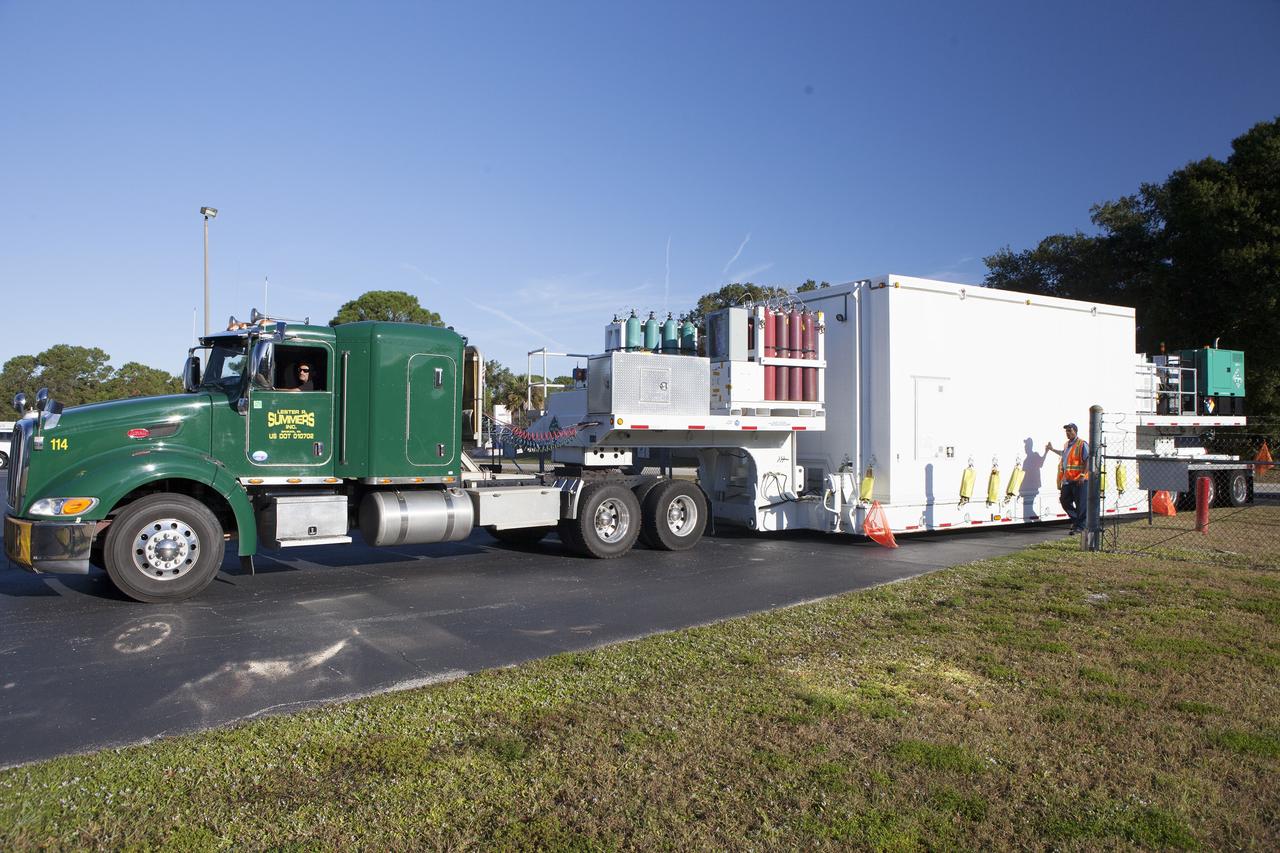 CAPE CANAVERAL, Fla. – The Magnetospheric Multiscale spacecraft, enclosed in a protective shipping container, are delivered by truck to the Astrotech payload processing facility in Titusville, Florida, near Kennedy Space Center.    MMS is a Solar Terrestrial Probes mission comprising four identically instrumented spacecraft that will use Earth’s magnetosphere as a laboratory to study the microphysics of three fundamental plasma processes: magnetic reconnection, energetic particle acceleration and turbulence.  Launch aboard a United Launch Alliance Atlas V rocket from Space Launch Complex 41 on Cape Canaveral Air Force Station is targeted for March 12, 2015. To learn more about MMS, visit http://mms.gsfc.nasa.gov.  Photo credit: NASA/Kim Shiflett