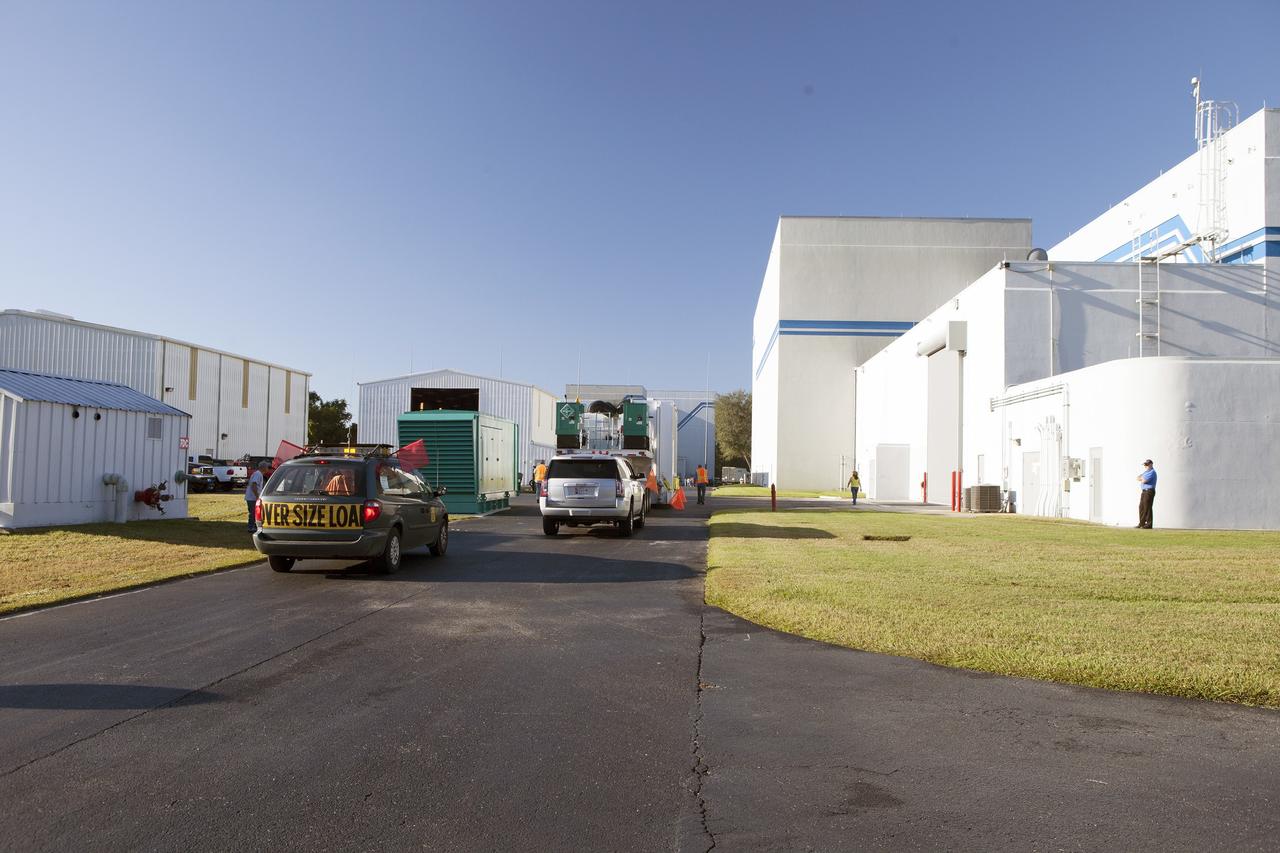 CAPE CANAVERAL, Fla. – The Magnetospheric Multiscale spacecraft, enclosed in a protective shipping container, arrive at Building 2 of the Astrotech payload processing facility in Titusville, Florida, near Kennedy Space Center.    MMS is a Solar Terrestrial Probes mission comprising four identically instrumented spacecraft that will use Earth’s magnetosphere as a laboratory to study the microphysics of three fundamental plasma processes: magnetic reconnection, energetic particle acceleration and turbulence.  Launch aboard a United Launch Alliance Atlas V rocket from Space Launch Complex 41 on Cape Canaveral Air Force Station is targeted for March 12, 2015. To learn more about MMS, visit http://mms.gsfc.nasa.gov.  Photo credit: NASA/Kim Shiflett