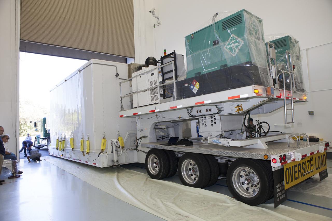 CAPE CANAVERAL, Fla. – Preparations are underway to remove the lower stack, mini-stack number 1, two of the observatories for NASA's Magnetospheric Multiscale Observatory, or MMS, from their protective shipping container in the Building 2 south encapsulation bay at the Astrotech payload processing facility in Titusville, Florida, near Kennedy Space Center.    The MMS upper stack, mini-stack number 2, is scheduled to arrive in about two weeks.  MMS is a Solar Terrestrial Probes mission comprising four identically instrumented spacecraft that will use Earth’s magnetosphere as a laboratory to study the microphysics of three fundamental plasma processes: magnetic reconnection, energetic particle acceleration and turbulence.  Launch aboard a United Launch Alliance Atlas V rocket from Space Launch Complex 41 on Cape Canaveral Air Force Station is targeted for March 12, 2015. To learn more about MMS, visit http://mms.gsfc.nasa.gov.  Photo credit: NASA/Dan Casper
