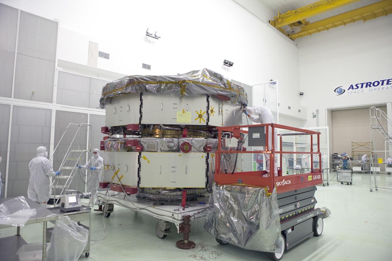 CAPE CANAVERAL, Fla. – Technicians have removed most of the protective covering from the lower stack, mini-stack number 1, two of the observatories for NASA's Magnetospheric Multiscale Observatory, or MMS, in Building 1 D high bay at the Astrotech payload processing facility in Titusville, Florida, near Kennedy Space Center.    The MMS upper stack, mini-stack number 2, is scheduled to arrive in about two weeks.  MMS is a Solar Terrestrial Probes mission comprising four identically instrumented spacecraft that will use Earth’s magnetosphere as a laboratory to study the microphysics of three fundamental plasma processes: magnetic reconnection, energetic particle acceleration and turbulence.  Launch aboard a United Launch Alliance Atlas V rocket from Space Launch Complex 41 on Cape Canaveral Air Force Station is targeted for March 12, 2015. To learn more about MMS, visit http://mms.gsfc.nasa.gov.  Photo credit: NASA/Dan Casper
