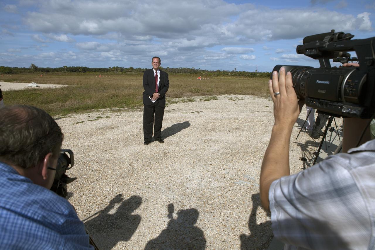 CAPE CANAVERAL, Fla. - Tom Engler, deputy director of Center Planning and Development at NASA's Kennedy Space Center in Florida, speaks to members of the media during an event to announce the agency's Lunar Cargo Transportation and Landing by Soft Touchdown, or Lunar CATALYST, initiative and introduced one of the partners, Moon Express Inc. of Moffett Field, California. The event took place at Kennedy's automated landing and hazard avoidance technology, or ALHAT, hazard field at the north end of the Shuttle Landing Facility.    Moon Express is developing a lander with   capabilities that will enable delivery of payloads to the surface of the moon, as well as new science and exploration missions of interest to  NASA and scientific and academic communities. Moon Express will base its activities at Kennedy and utilize the Morpheus ALHAT field and a hangar nearby for CATALYST testing. The Advanced Exploration Systems Division of NASA's Human Exploration and Operations Mission Directorate manages Lunar CATALYST. Photo credit: NASA/Ben Smegelsky