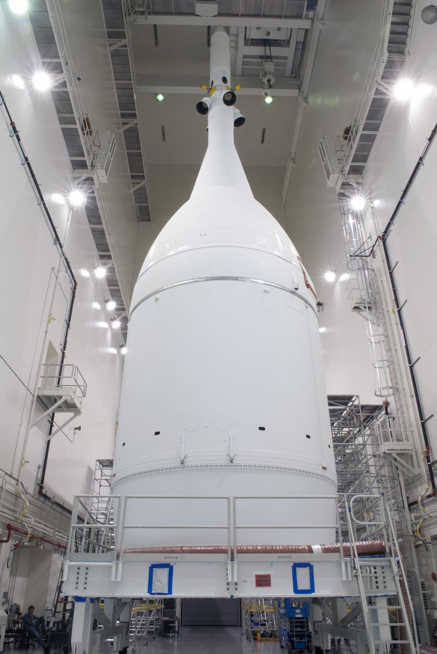CAPE CANAVERAL, Fla. – The Orion spacecraft sits inside the Launch Abort System Facility at NASA's Kennedy Space Center in Florida. The Ogive panels have been installed around the launch abort system. The panels will smooth the airflow over the conical spacecraft to limit sound and vibration, which will make for a much smoother ride for the astronauts who will ride inside Orion in the future. The spacecraft is being readied for its move to Space Launch Complex 37 at Cape Canaveral Air Force Station for its flight test. Orion is the exploration spacecraft designed to carry astronauts to destinations not yet explored by humans, including an asteroid and Mars. It will have emergency abort capability, sustain the crew during space travel and provide safe re-entry from deep space return velocities. The first unpiloted flight test of Orion is scheduled to launch in December 2014 atop a United Launch Alliance Delta IV Heavy rocket, and in 2018 on NASA’s Space Launch System rocket. For more information, visit www.nasa.gov/orion. Photo credit: Jim Grossman
