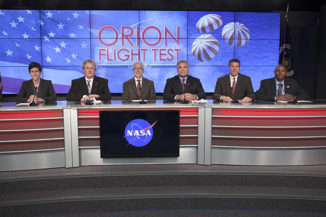 CAPE CANAVERAL, Fla. – In the Kennedy Space Center’s Press Site auditorium, members of the news media are briefed on the upcoming Orion flight test. From left are: Rachel Kraft, NASA Public Affairs, Bill Hill, NASA deputy associate administrator for Exploration Systems Development, Mark Geyer, NASA Orion Program manager, Bryan Austin, Lockheed Martin mission manager, Jeremy Graeber, Operations Integration Branch of Ground Systems Development and Operations at Kennedy, and Ron Fortson, United Launch Alliance director of Mission Management. Mike Sarafin, NASA's lead flight director, participated by video from the Johnson Space Center.      Orion is the exploration spacecraft designed to carry astronauts to destinations not yet explored by humans, including an asteroid and Mars. It will have emergency abort capability, sustain the crew during space travel and provide safe re-entry from deep space return velocities. The first unpiloted flight test of Orion is scheduled to launch Dec. 4, 2014 atop a United Launch Alliance Delta IV Heavy rocket, and in 2018 on NASA’s Space Launch System rocket. For more information, visit www.nasa.gov/orion Photo credit: NASA/Kim Shiflett