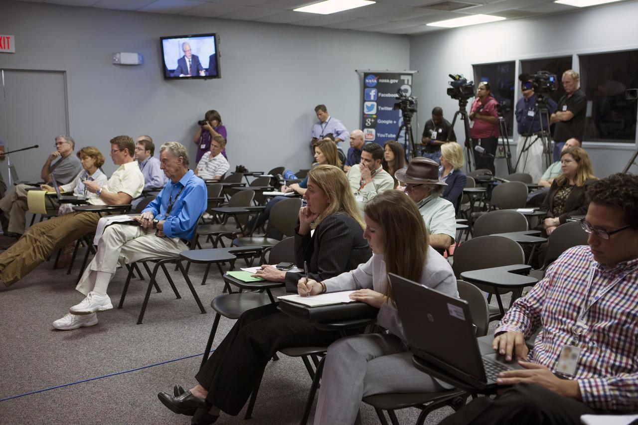 CAPE CANAVERAL, Fla. – In the Kennedy Space Center’s Press Site auditorium, members of the news media listen as NASA and contractor officials plans for the upcoming Orion flight test.      Orion is the exploration spacecraft designed to carry astronauts to destinations not yet explored by humans, including an asteroid and Mars. It will have emergency abort capability, sustain the crew during space travel and provide safe re-entry from deep space return velocities. The first unpiloted flight test of Orion is scheduled to launch Dec. 4, 2014 atop a United Launch Alliance Delta IV Heavy rocket, and in 2018 on NASA’s Space Launch System rocket. For more information, visit www.nasa.gov/orion Photo credit: NASA/Kim Shiflett