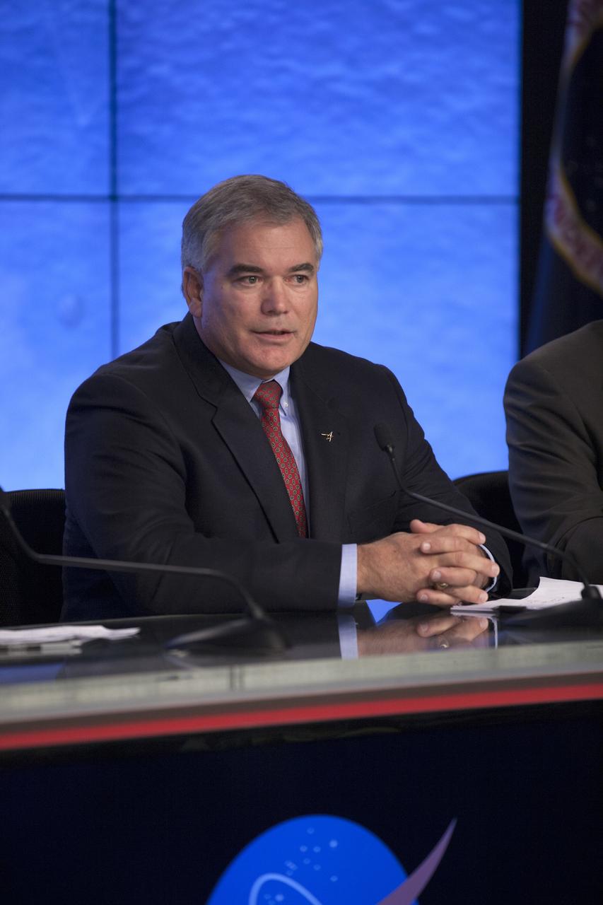 CAPE CANAVERAL, Fla. – In the Kennedy Space Center’s Press Site auditorium, members of the news media are briefed on the upcoming Orion flight test by Bryan Austin, Lockheed Martin mission manager.    Orion is the exploration spacecraft designed to carry astronauts to destinations not yet explored by humans, including an asteroid and Mars. It will have emergency abort capability, sustain the crew during space travel and provide safe re-entry from deep space return velocities. The first unpiloted flight test of Orion is scheduled to launch Dec. 4, 2014 atop a United Launch Alliance Delta IV Heavy rocket, and in 2018 on NASA’s Space Launch System rocket. For more information, visit www.nasa.gov/orion Photo credit: NASA/Kim Shiflett