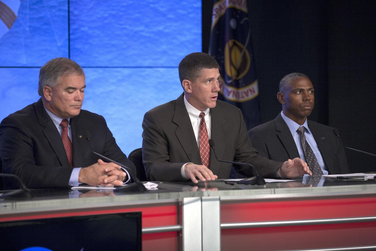 CAPE CANAVERAL, Fla. – In the Kennedy Space Center’s Press Site auditorium, members of the news media are briefed on the upcoming Orion flight test by Jeremy Graeber, Orion Recovery Director in Ground Systems Development and Operations at Kennedy. Also participating in the news conference are Bryan Austin, Lockheed Martin mission manager, left, and Ron Fortson, United Launch Alliance director of Mission Management.      Orion is the exploration spacecraft designed to carry astronauts to destinations not yet explored by humans, including an asteroid and Mars. It will have emergency abort capability, sustain the crew during space travel and provide safe re-entry from deep space return velocities. The first unpiloted flight test of Orion is scheduled to launch Dec. 4, 2014 atop a United Launch Alliance Delta IV Heavy rocket, and in 2018 on NASA’s Space Launch System rocket. For more information, visit www.nasa.gov/orion Photo credit: NASA/Kim Shiflett